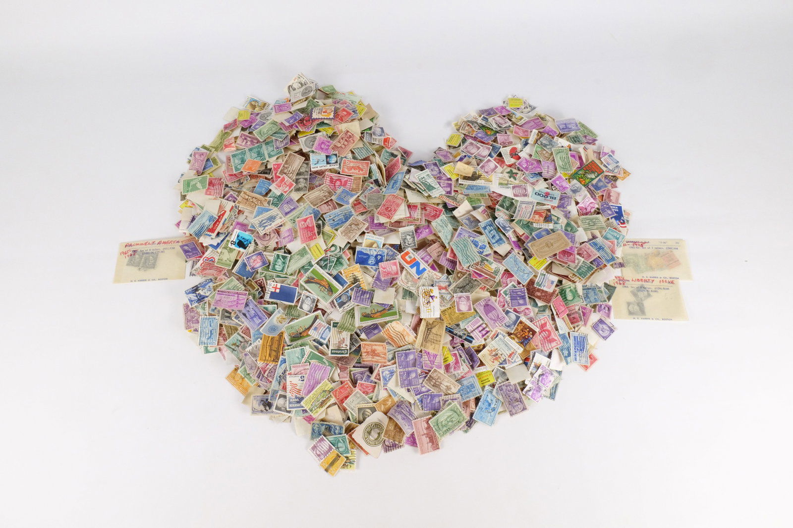 A Lot of US and World 20th Century Postage Stamps: Bulk philatelic assembly containing a diverse range of US and international postage stamps. Includes US definitive and commemorative issues such as Project Mercury, American Revolution Bicentennial, a