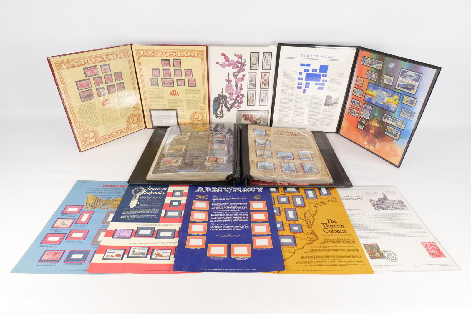 A Collection of US, CN, FR, and PY Philatelic Panels and Albums: This philatelic lot features a Franklin Mint The Classic U.S. Two-Cent Reds collection containing twenty 2-cent stamps issued between 1894 and 1932, including a Certificate of Authenticity. The collec