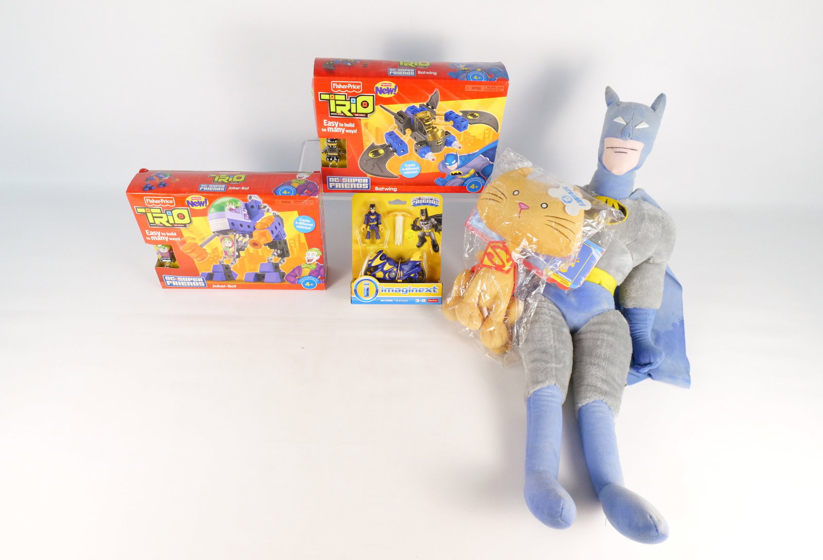 Lot of DC Collectibles: Lot of DC Collectibles. Including DC Super Pets Streaky in Package, Imaginex Batgirl and Cycle in Package, Fisher Price Trio Joker-Bot and Batwing in Boxes, and Vintage 28.5" Plush - Some staining and