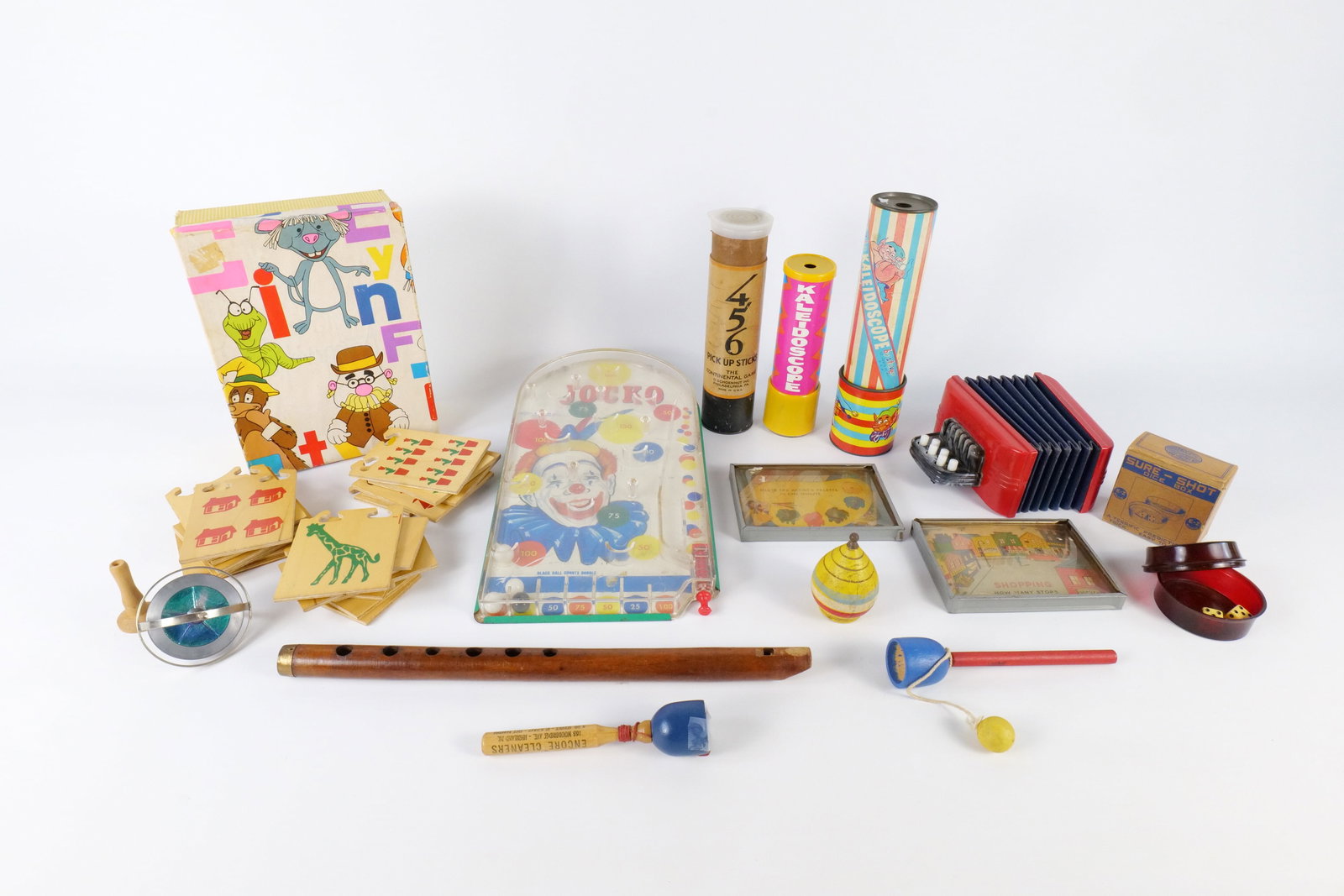 Lot of Vintage Toys: Lot of Vintage Toys. Including Jocko Game - Some cracking to plastic, Pixie Kaleidoscope, Pick Up Sticks, Sure Shot Dice Box in Box, Recorder, and More. All invoices must be paid within 24 hours of th