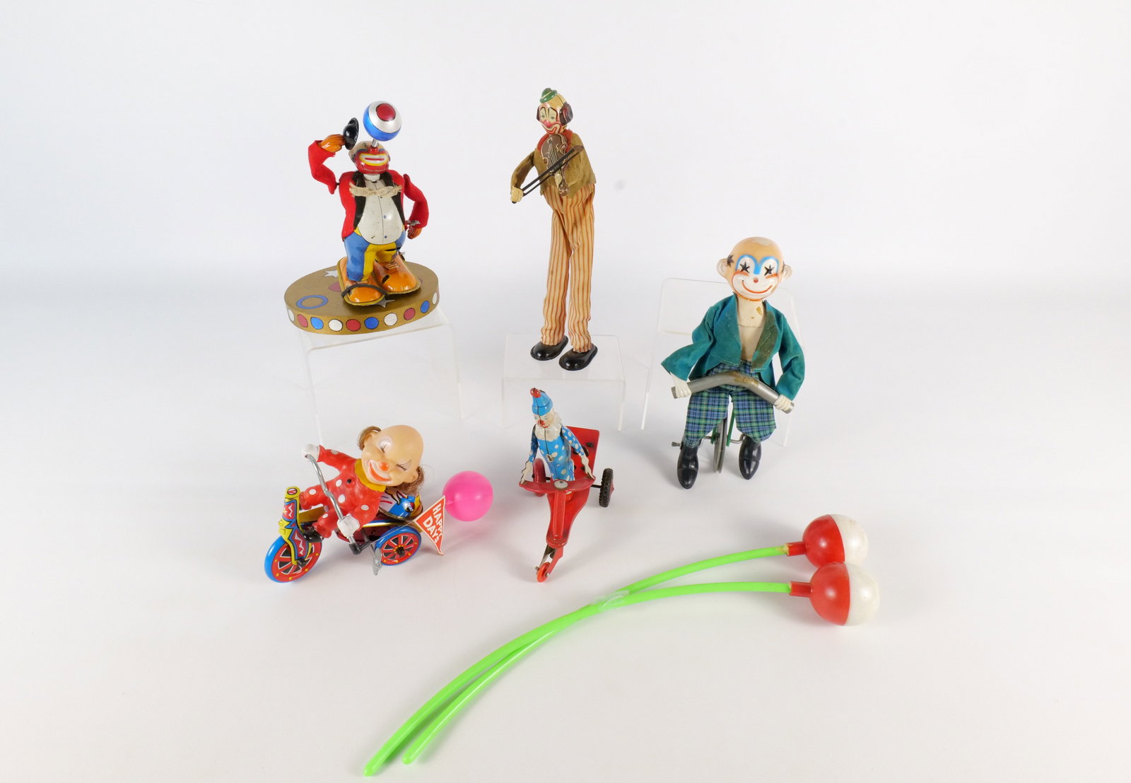 Lot of Circus Toys: Lot of Circus Toys - Mostly Tin Litho and Plastic Key Wind. Including Key Wind Clown, Key Wind Clown Playing Violin, Key Wind Clown on Bike, Key Wind Clown on Scooter, and More. All invoices must be p
