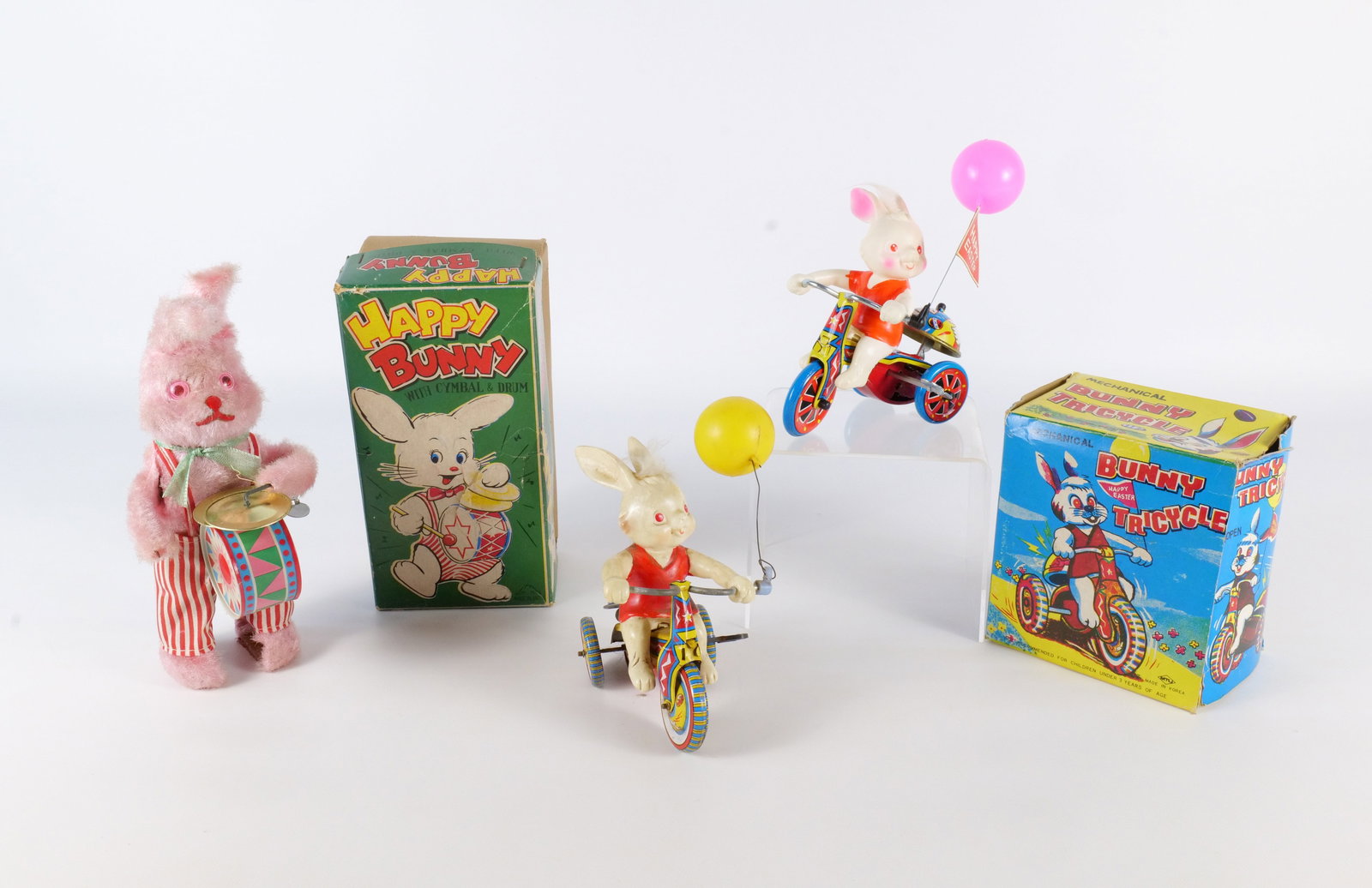 Lot of Bunny Mechanical Wind Up Toys: Lot of Bunny Mechanical Wind Up Toys. Including Bunny Tricycle in Box, Happy Bunny with Cymbal & Drum in Box, and Bunny on Tricycle. All invoices must be paid within 24 hours of the sale. We offer mul