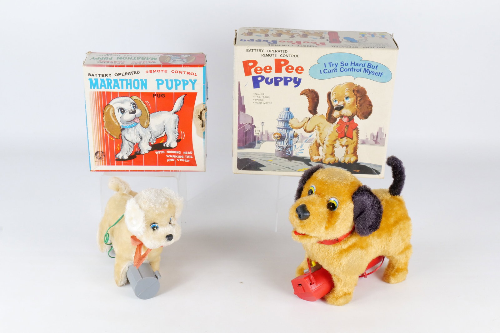 Lot of 2 Battery Operated Dogs: Lot of 2 Battery Operated Dogs. Including Marathon Puppy Remote Control and Pee Pee Puppy. Both come with original boxes. All invoices must be paid within 24 hours of the sale. We offer multiple shipp