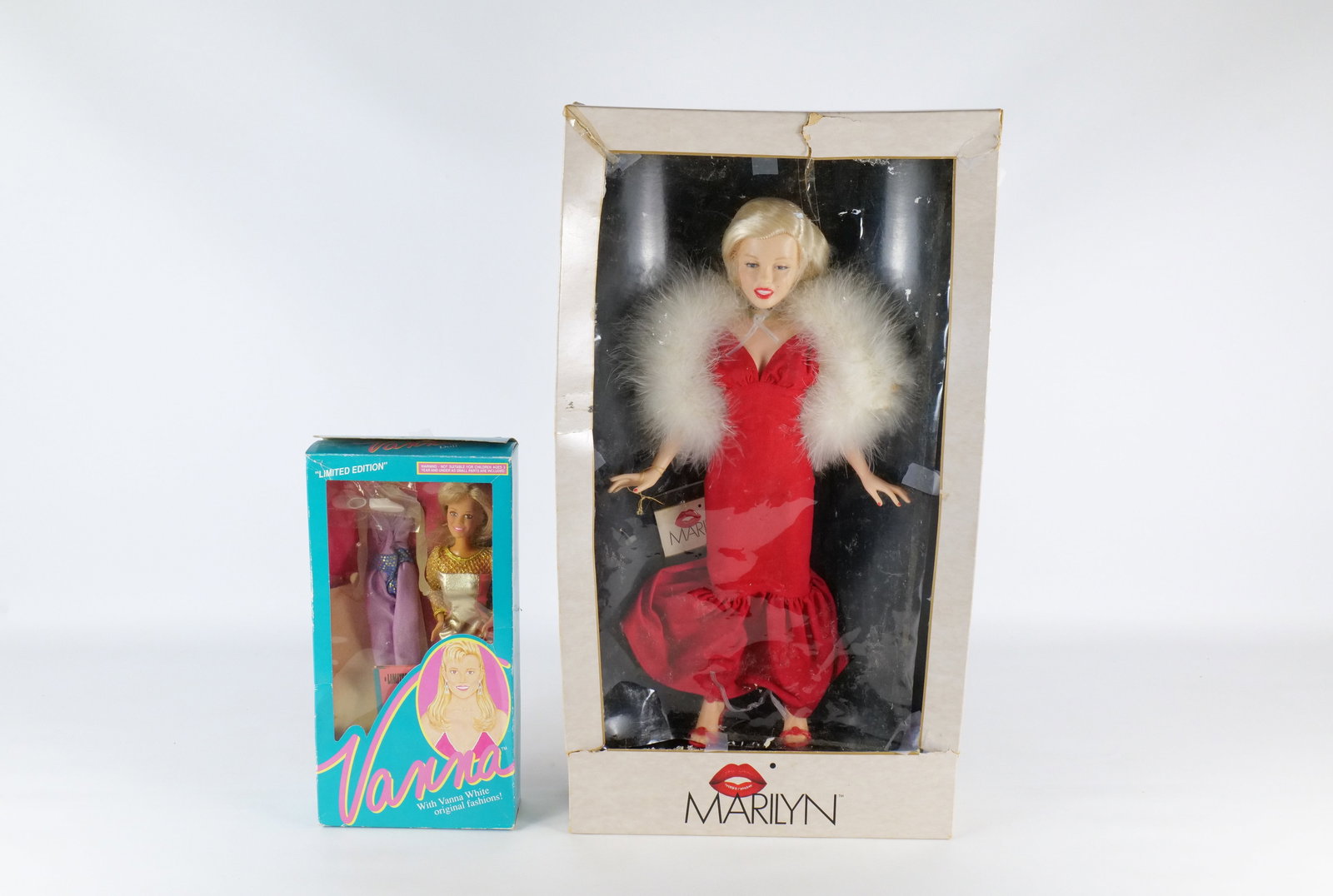 Lot of 2 Dolls: Lot of 2 Dolls. Including Vanna White and Marilyn. Both come with boxes. Boxes have wear. All invoices must be paid within 24 hours of the sale. We offer multiple shipping options, please read the shi