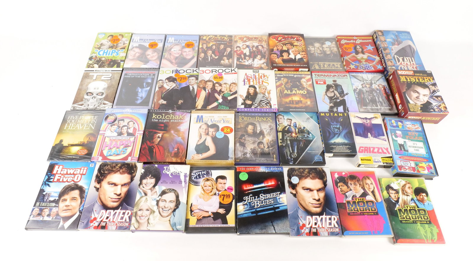 Lot of Mixed Movie and TV Series DVD's and VHS: Lot of Mixed Movie and TV Series DVD's and VHS. Including Spider-Man Titles, Sherlock Holmes Titles, The Mod Squad Season 1 & 2, Mystery Classics DVD Set, 30 Rock Season 1 & 2, X-Men, Dexter The Third