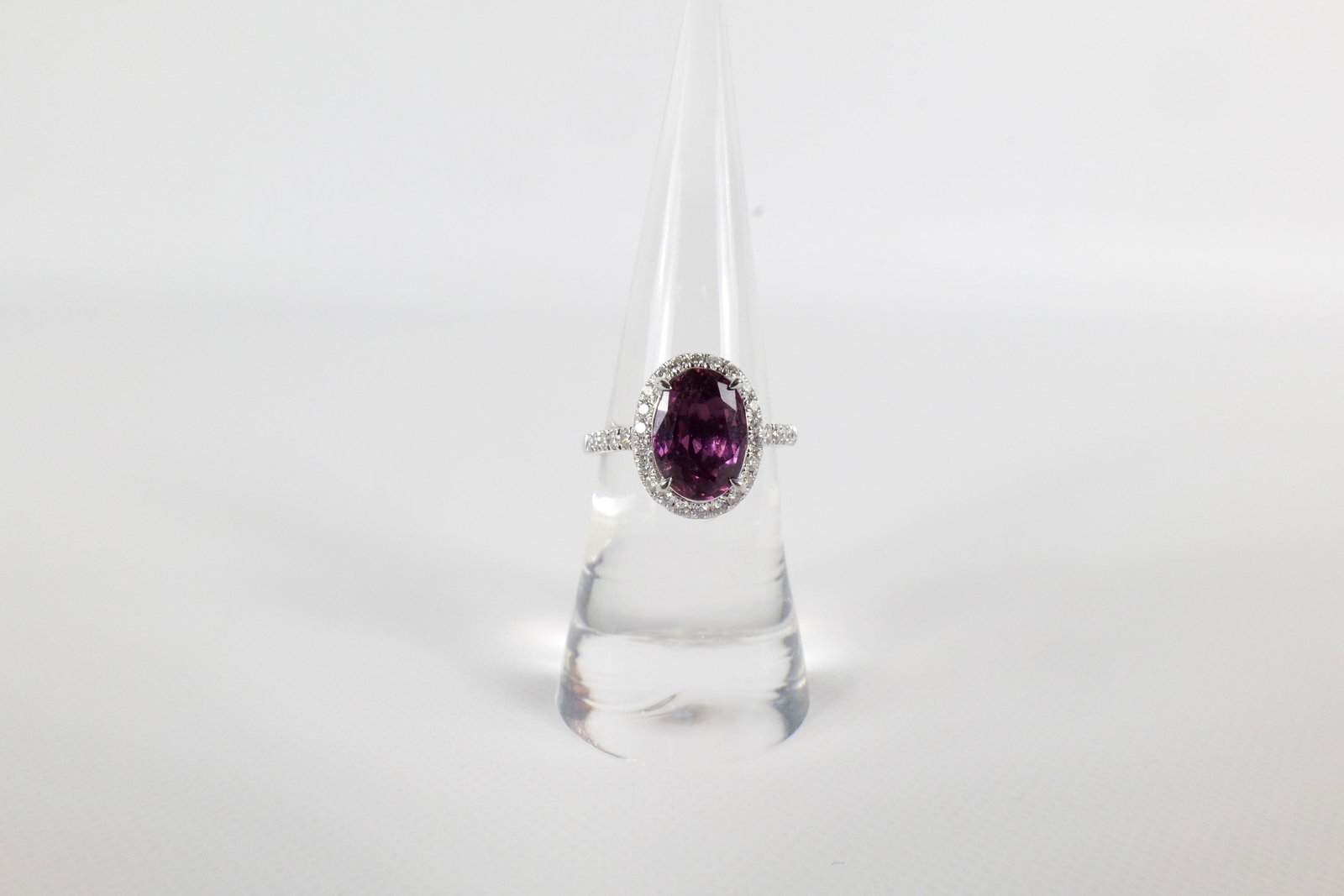 Oscar Friedman Platinum Spinel and Diamond Ring: Platinum Spinel and Diamond Ring. Marked Oscar Friedman. Contains Spinel Center Stone weighing 3.35 carats and 32 Round Diamonds weighing approx. .40 carats. Total Ring weight is 5.9 grams. Ring Size