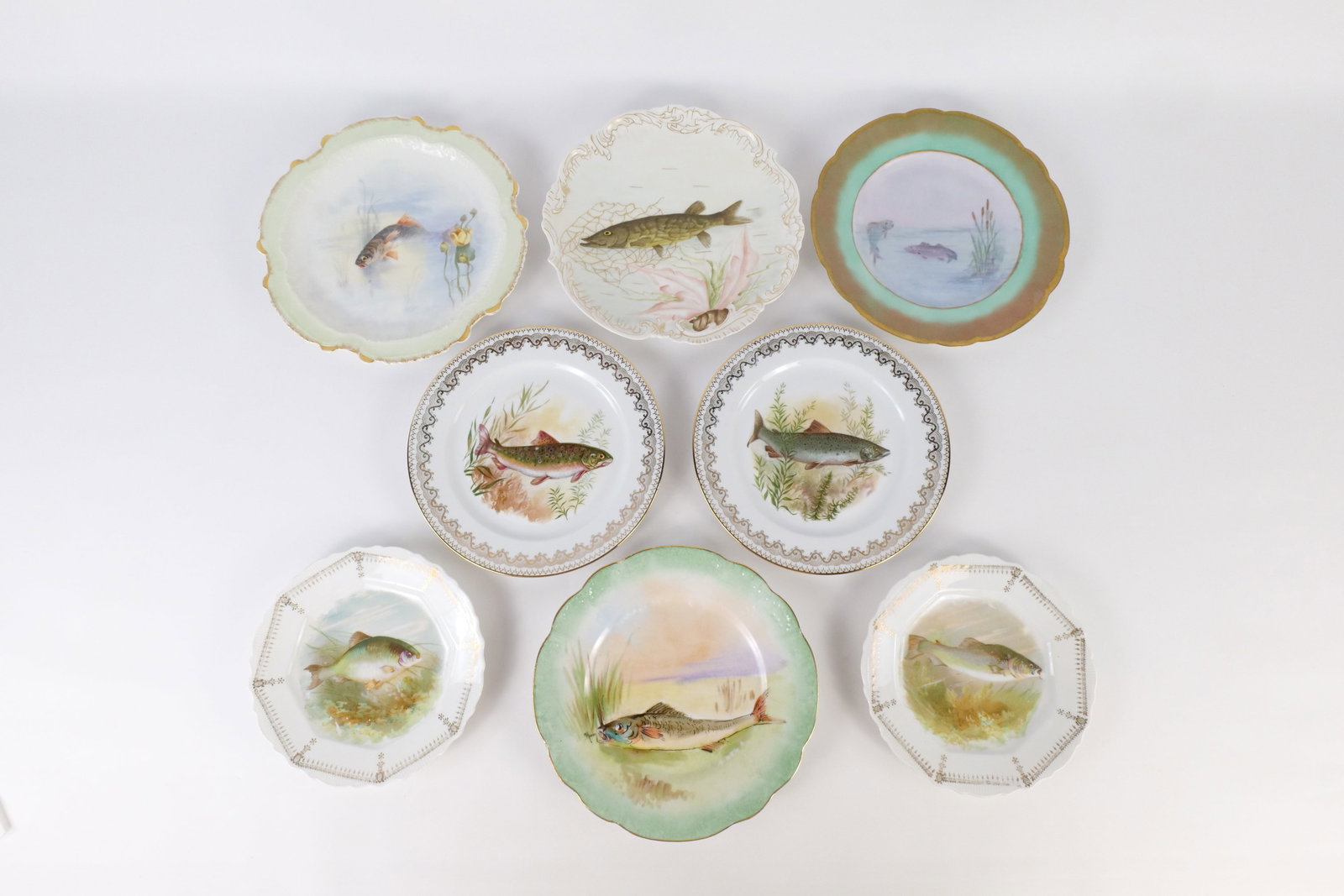 Lot of 8 Porcelain Fish Plates: Lot of 8 Porcelain Fish Plates. Including Transferware and Hand Painted. Including Haviland, Limoges, D&C France, 2 x Bavaria, 2 x B&Co Limoges, and ED Limoges. Small hairline crack on two plates. Lar