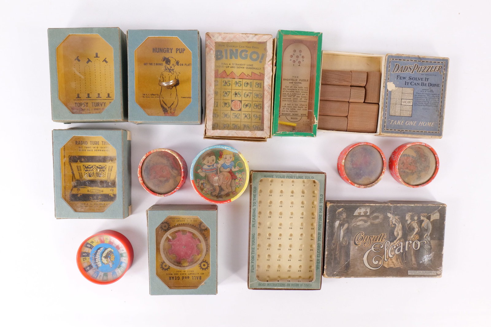 Lot of 13 Antique Dexterity Puzzle and Game Lot: Lot of 13 Antique Dexterity Puzzle and Game Lot. Including A.C. Gilbert, Elcaro, 1920's Litho and More. Some of the games are "Dad's Puzzle", Hungry Pup, Topsy Turvy Rivets, Consult Elcaro, The Bagate
