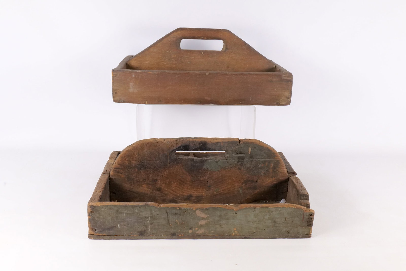 Two Antique Wooden Tool Caddies: Lot of Two Antique Wooden Tool Totes, or Caddies. Both are constructed from softwood with nailed joinery. The first caddy has a natural wood finish with a dark aged patina. It features a single