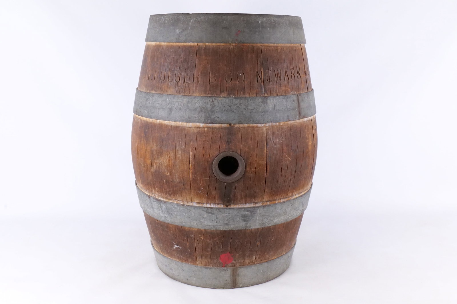 Vintage G. Krueger Brewing Co. Beer Barrel, Newark, New Jersey: A vintage beer barrel produced for the G. Krueger Brewing Company of Newark, New Jersey. The item features a traditional stave construction secured by four galvanized metal hoops. The side of the