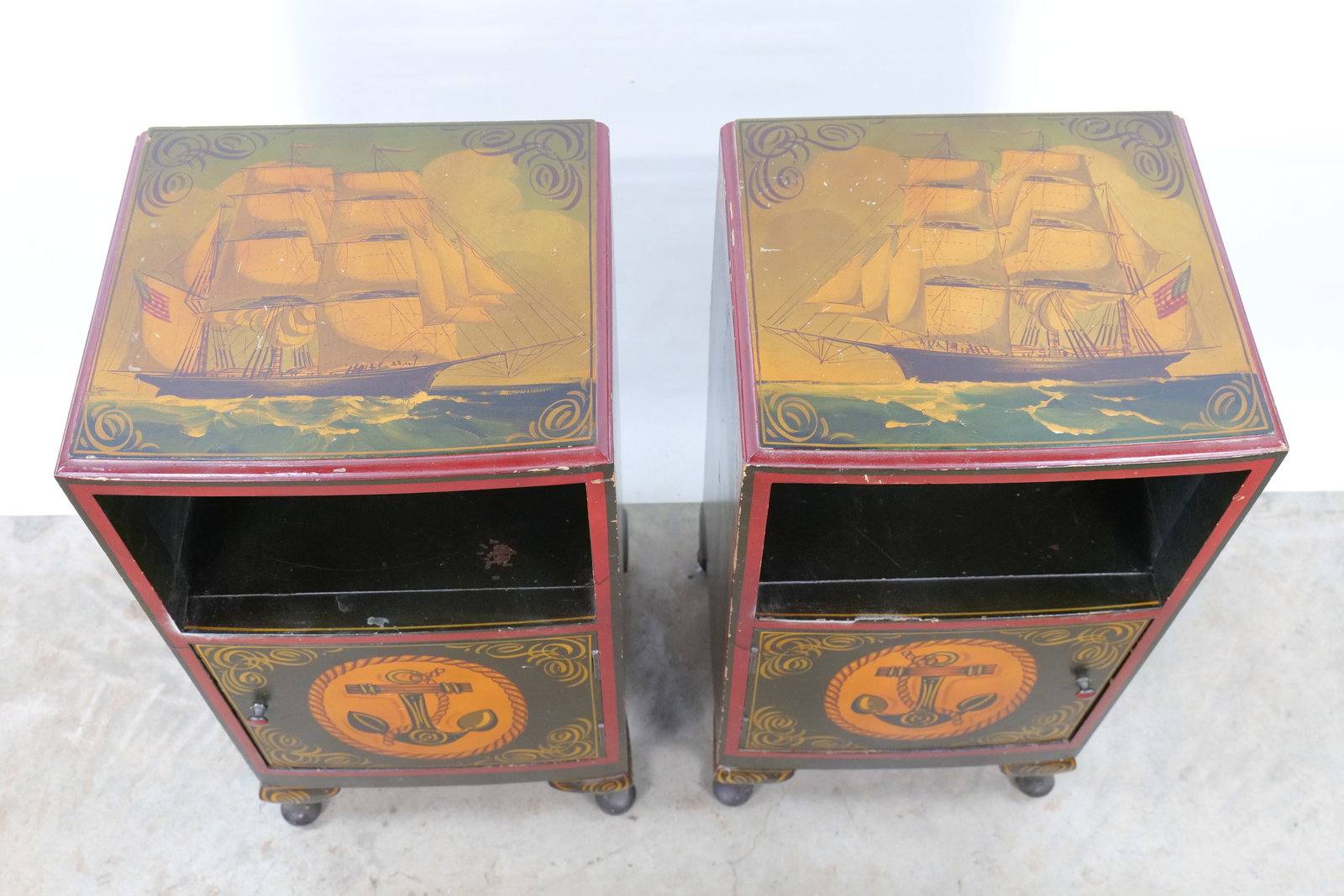 Pair of Mid Century Nautical Folk Art Painted Cabinets: This pair of small cabinets or nightstands was produced as part of the Maple Quality furniture line. Each unit is constructed from wood, specifically maple as indicated by the manufacturer mark, and