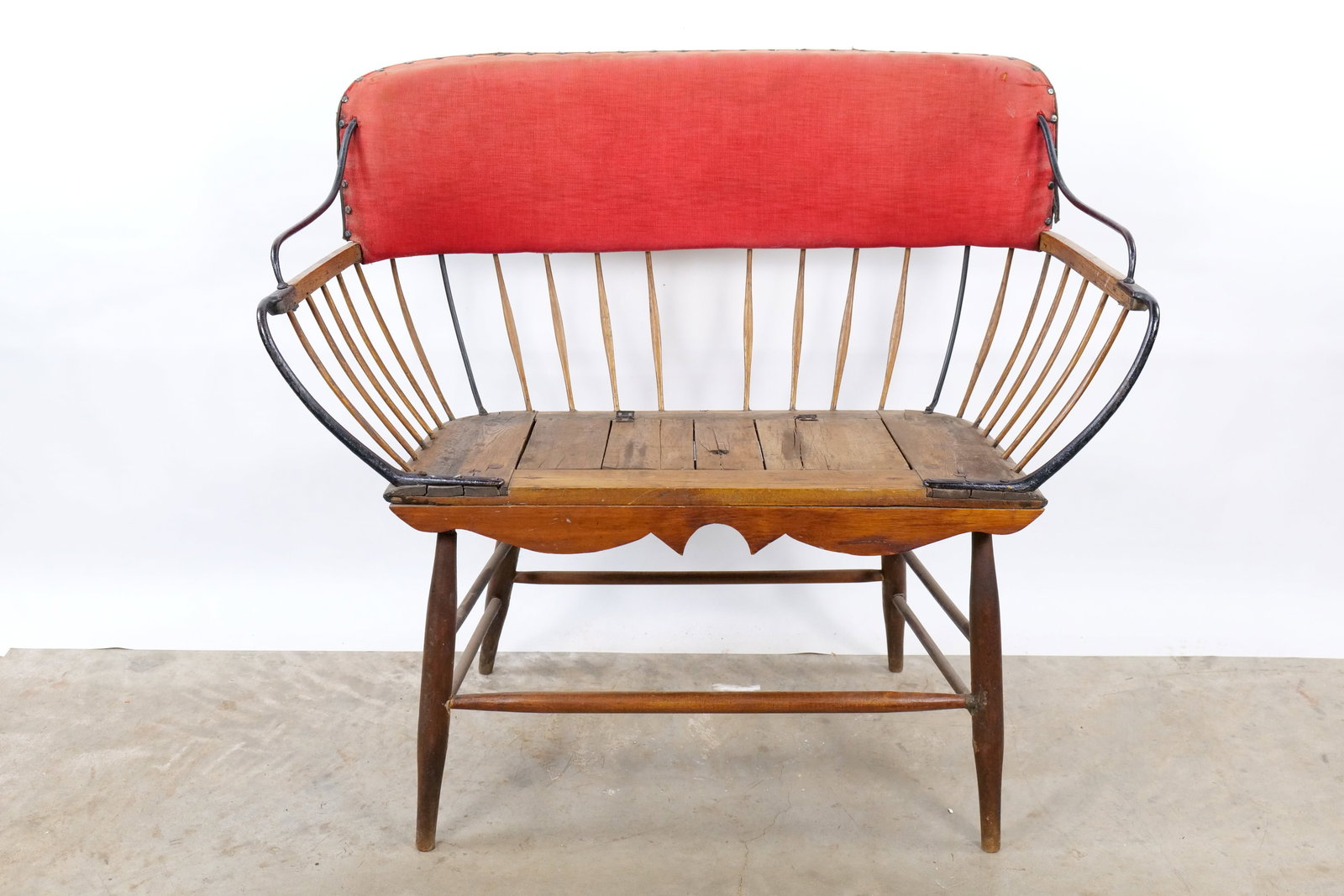 Antique Carriage-Style Windsor Settee: Antique Carriage-Style Windsor Settee - Spindle Back Fireside Bench with Hidden Storage. Seat is built from solid weathered wood and is reinforced with hand forged iron supports. The center of the sea