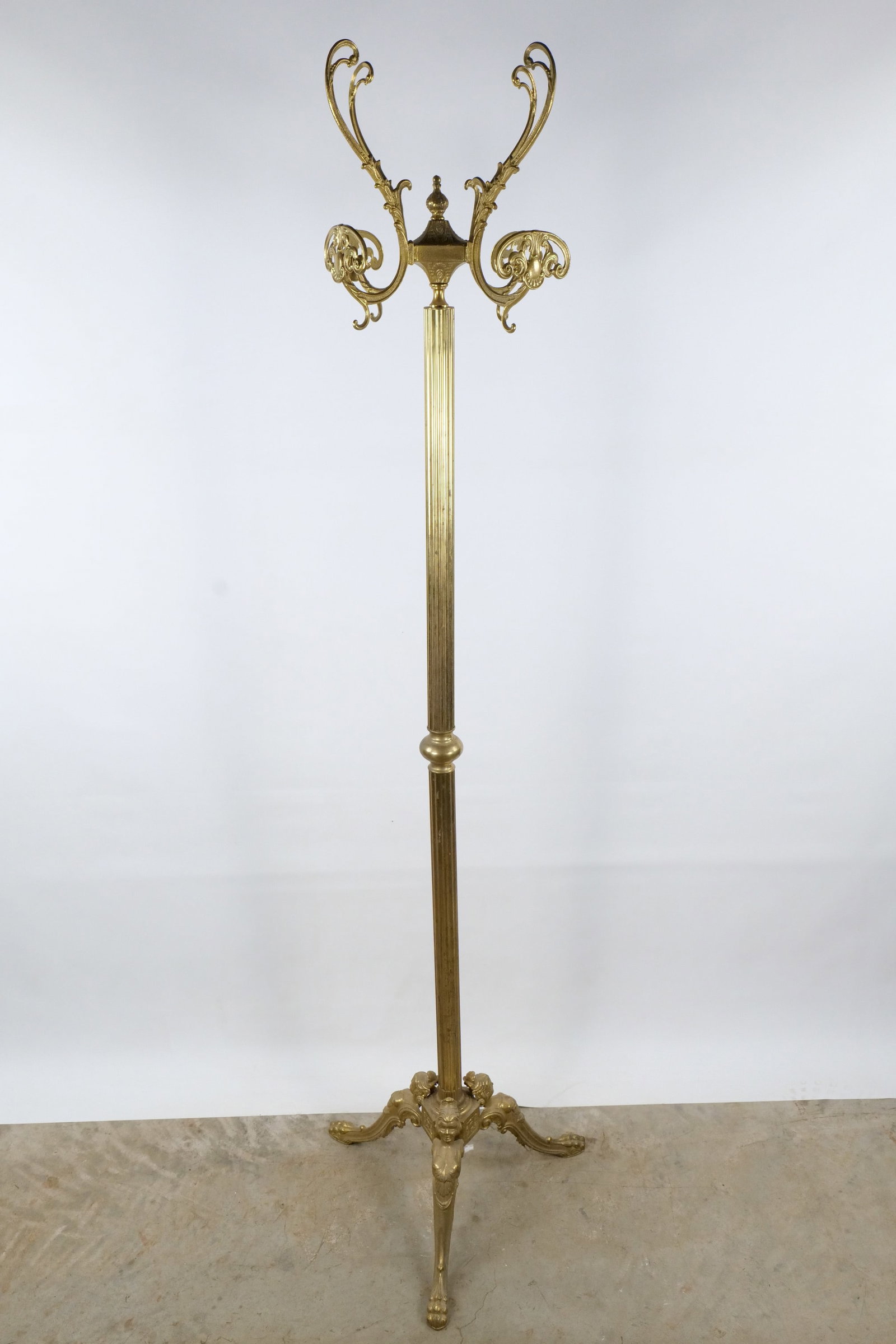Vintage Italian Ornate Brass Coat Rack: Vintage Italian Ornate Brass Coat Rack - Figural Winged Siren Base - Victorian Style. Fluted Column with Six Large Double-Hooks. Age appropriate wear. Measures 70.5" tall x 19.5" wide. All invoices