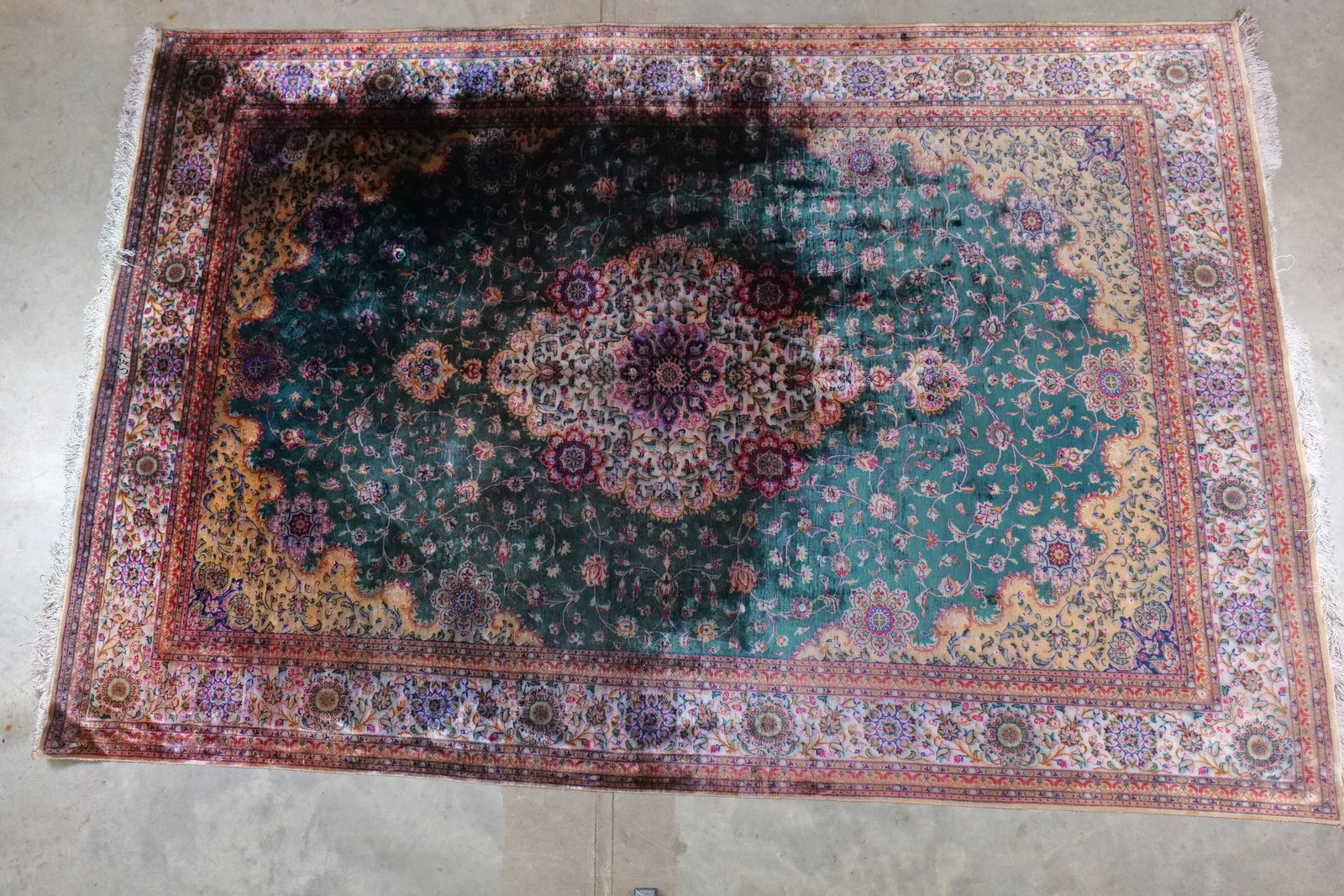Vintage Hand-Knotted Persian Medallion Area Rug: Vintage Hand-Knotted Persian Medallion Area Rug. Intricate "Shah Abbasi" floral motifs with multi-layered border and hand tied fringe. Staining present on most of the rug. Heavier wear. Small tears,