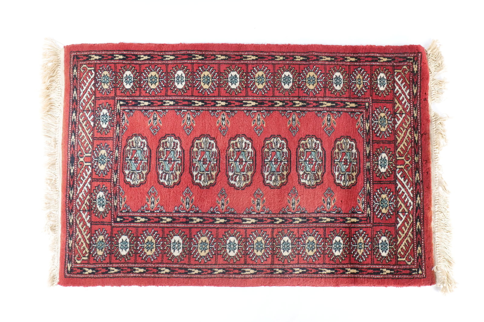 Hand-Knotted Pakistani Bokhara Rug - Traditional Red Wool Accent Rug: Hand-Knotted Pakistani Bokhara Rug - Traditional Red Wool Accent Rug. 100% Wool Pile. Areas of wear present on the pile. Measures 24.5" x 42". All invoices must be paid within 24 hours of the sale. We