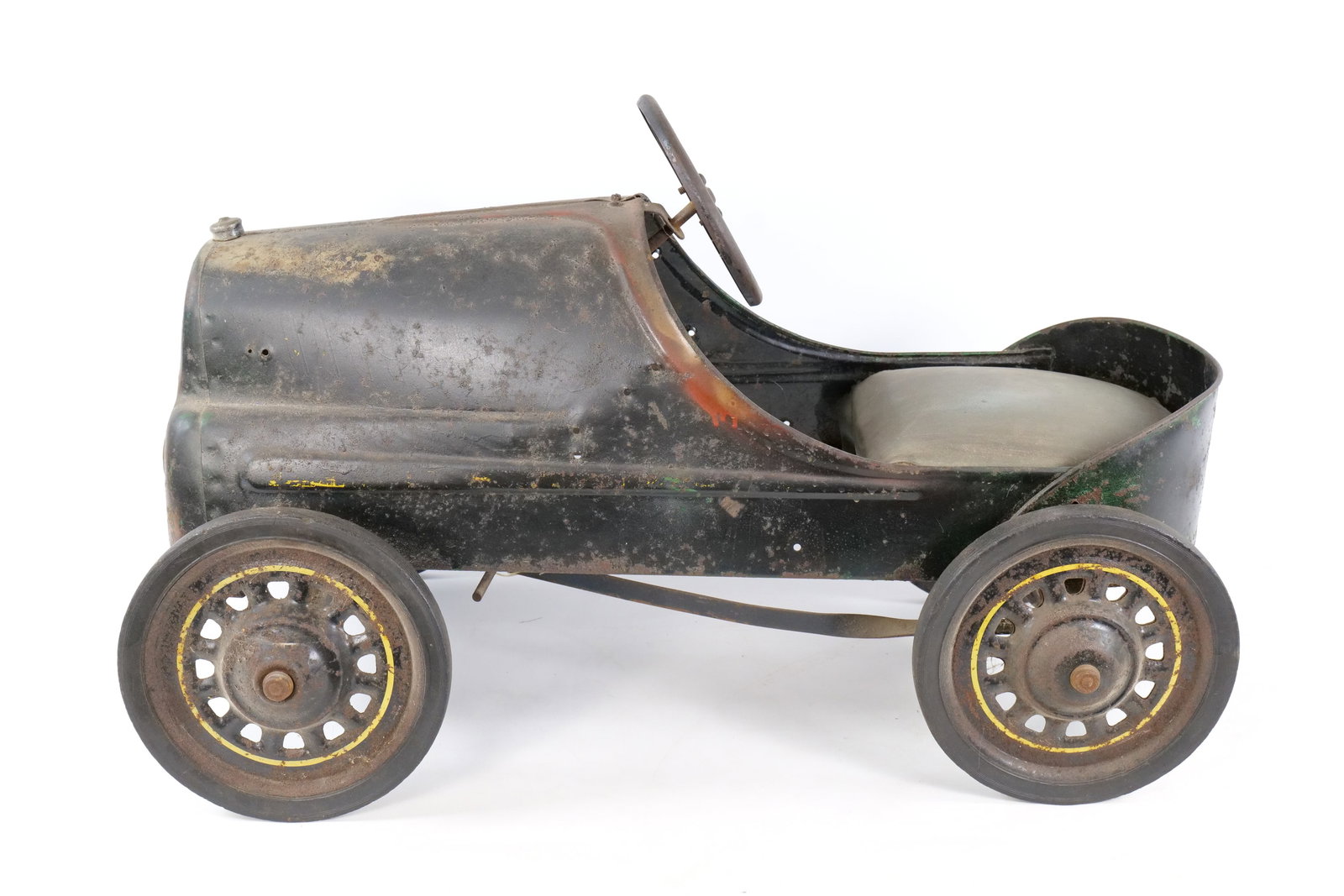 Vintage 1930's/40's Garton Metal Pedal Car: Vintage 1930's/40's Garton Metal Pedal Car. Pressed steel streamline body and original "G" logo emblem on the front grill. Original metal wheels with yellow pinstripe detailing and solid rubber tires.