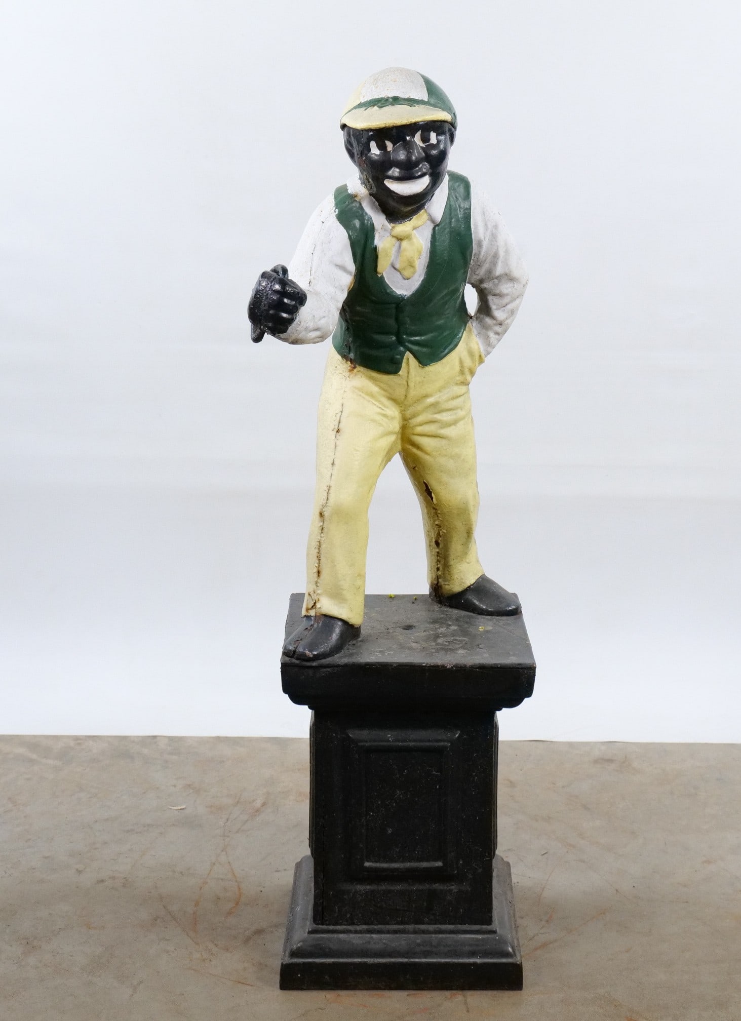 Vintage Cast Iron Cavalier Lawn Jockey Statue: Vintage Cast Iron Cavalier Lawn Jockey Statue. Visible paint wear and surface oxidation. Measures 38" tall x 10.5" wide. All invoices must be paid within 24 hours of the sale. We offer multiple shippi