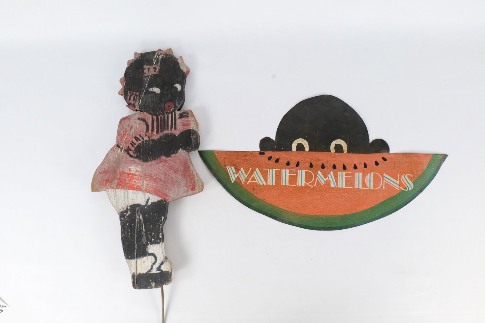 Vintage Hand Painted Folk Art Signs - Black Americana: Vintage Hand Painted Folk Art Signs - Black Americana. One is a "Peek-A-Boo" style watermelon tin sign and the other is a folk-art wooden cutout of a girl in a red dress - Garden stake or lawn ornamen