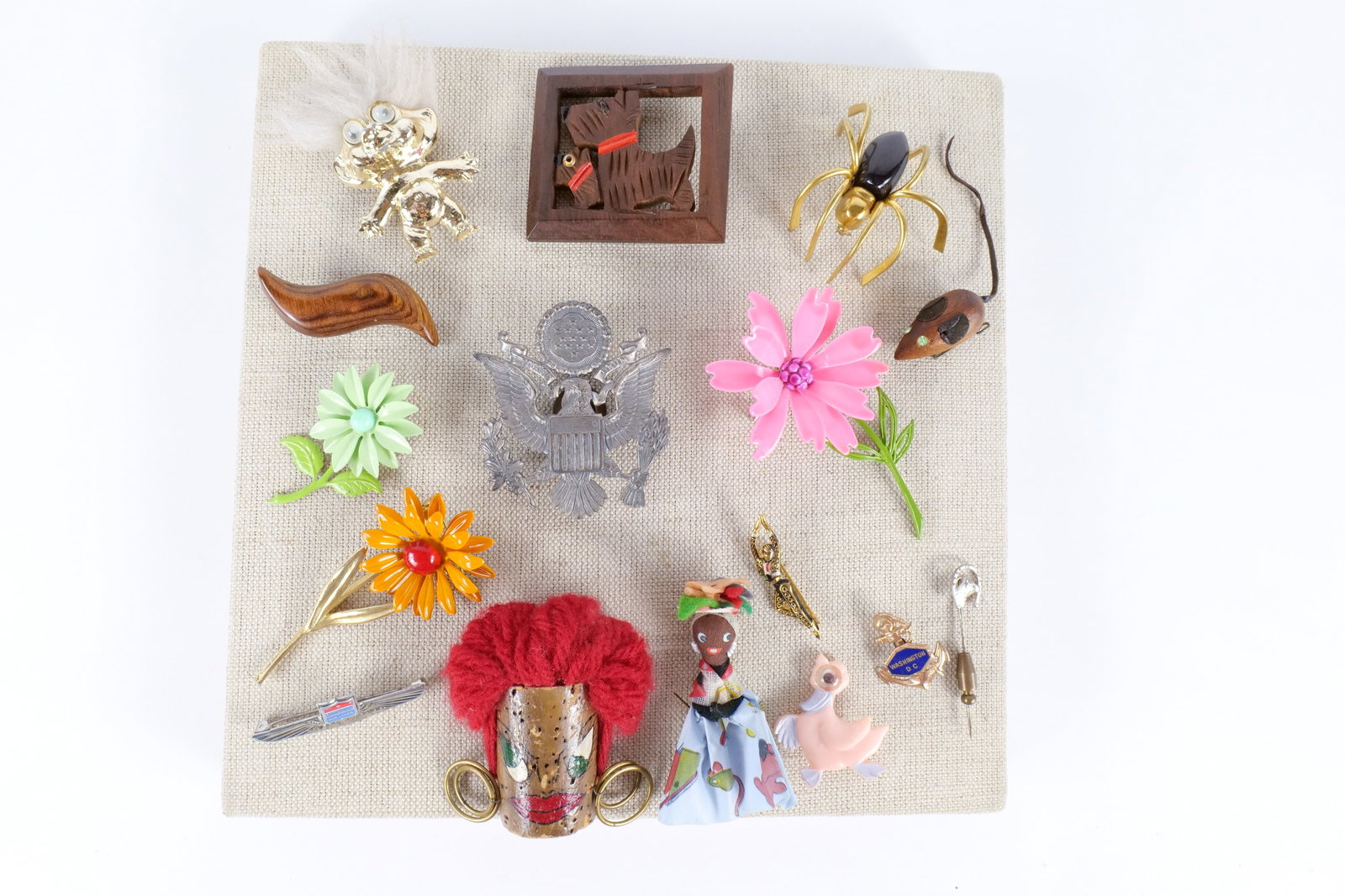 Lot of Vintage Pins: Lot of vintage pins including United Airlines, Washington DC, Troll, carved wood spider, flowers and more. Measures approximately between one inch and three inches. All invoices must be paid within