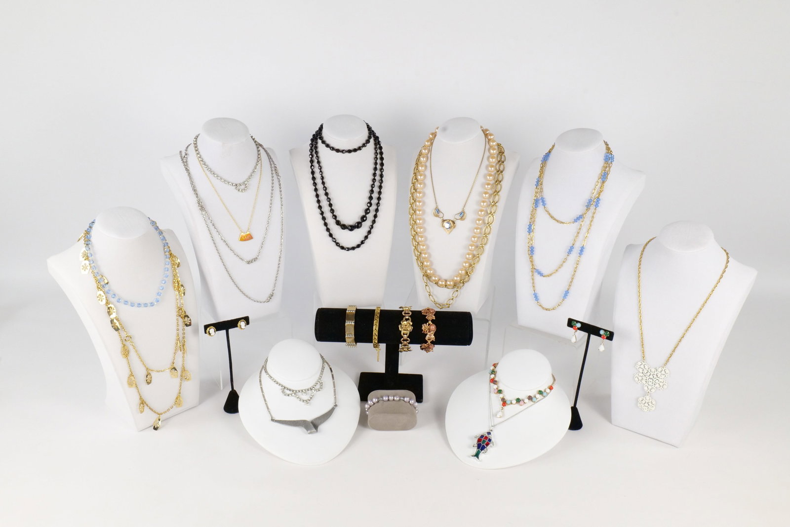 Lot of Costume Jewelry: Lot of costume jewelry including FREIRICH bangle, blue faceted crystal necklace, art pewter hammered modernist necklace, Sarah COV Enamel Fish Necklace, rhinestone pieces, Kreisler Flower Bracelet and