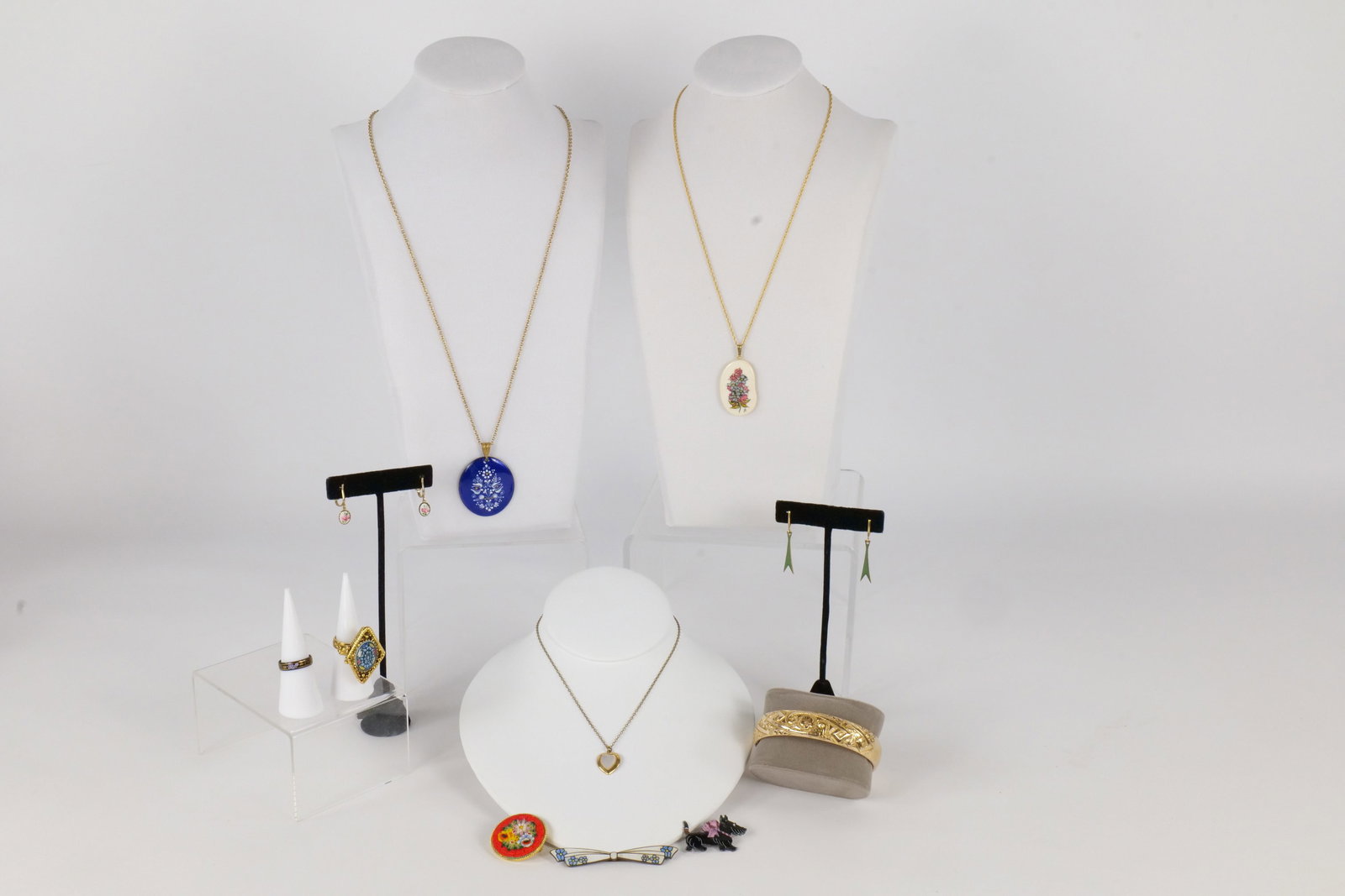 Lot of Vintage Jewelry: Lot of vintage jewelry including many made in Czechoslovakia pieces. The lot includes an adjustable mosaic style poison/perfume ring, a Victorian gold plated bangle, a mosaic pin, Scotty dog pins and 