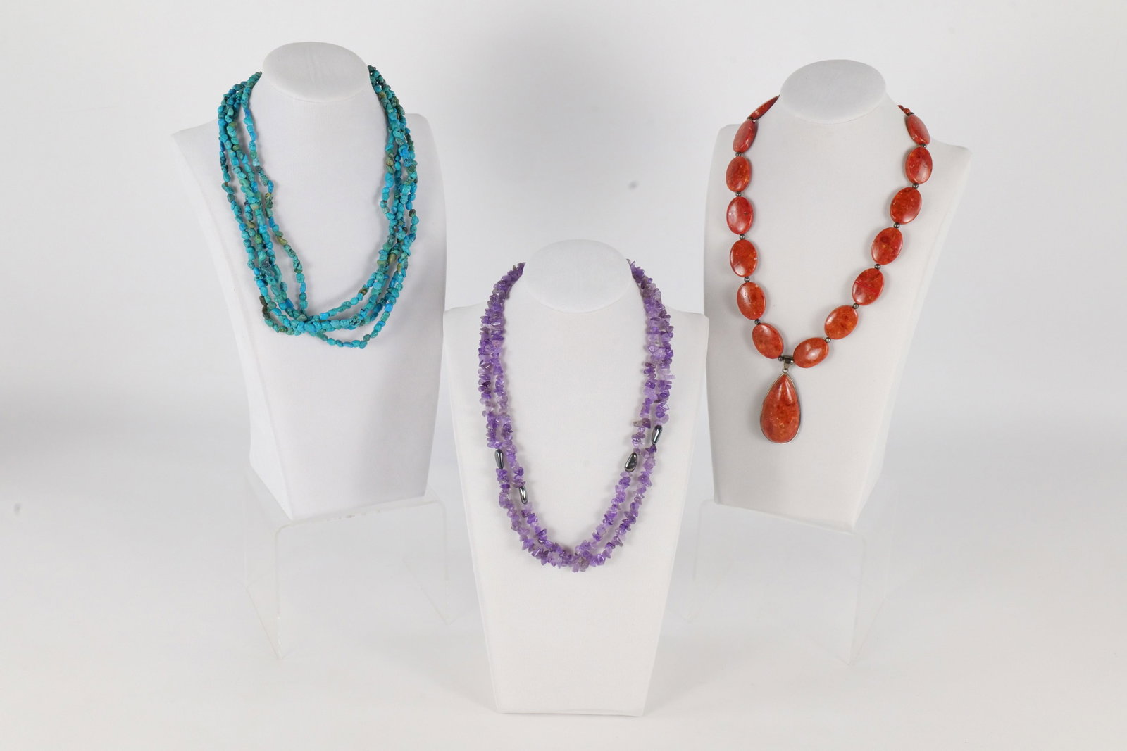 Lot of Sterling and Natural Stone Necklaces: Lot of sterling silver and natural stone necklaces including a chunky Lucas Lameth red stone Jasper beaded necklace, an amethyst and sterling clasped necklace, and a turquoise and sterling clasped mul