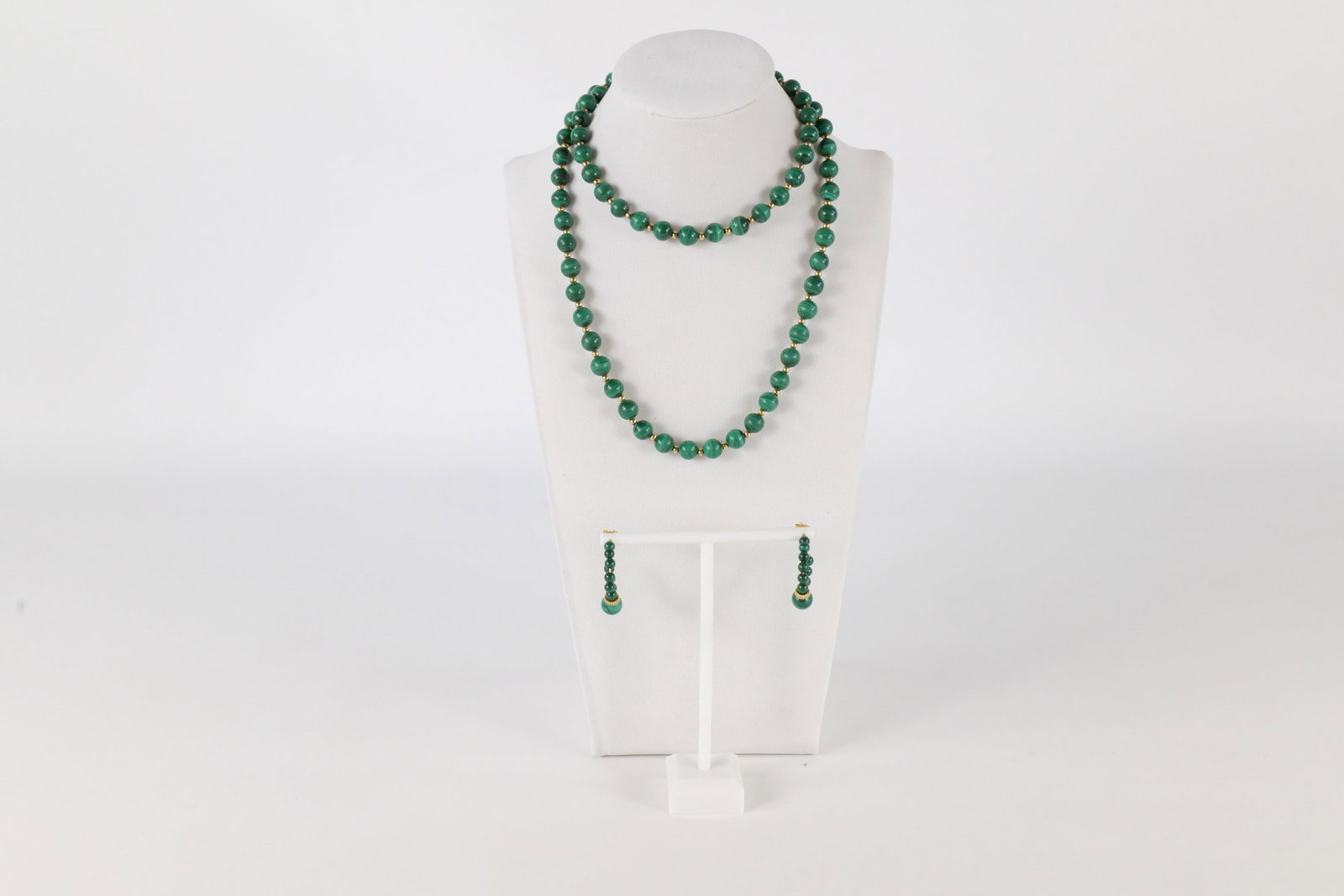 14K and Malachite Jewelry Set: A 14 K and malachite jewelry set including a necklace with green malachite beads and gold bead accents with a matching pair of 14 K green malachite earrings with gold accents and studs. The necklace m