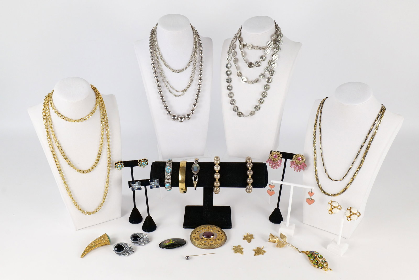 Lot of Vintage Jewelry: A lot of vintage jewelry including a Victorian gold tone sash pin or brooch, Weiss Milky white clip earrings, crystal earrings, Russian enamel floral pin, crown Trifari gold tone bangle bracelet, silv