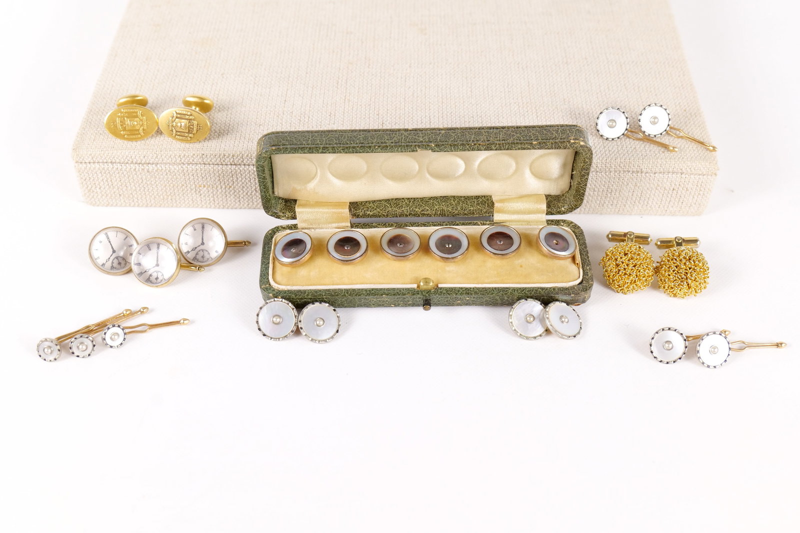 Lot of Vintage Cufflinks and Buttons: Lot of vintage cufflinks and buttons including Christian Dior vintage gold tone wire mesh orb cufflinks - one of the cufflinks is loose. Also included is a set of mother of Pearl dress studs in the or