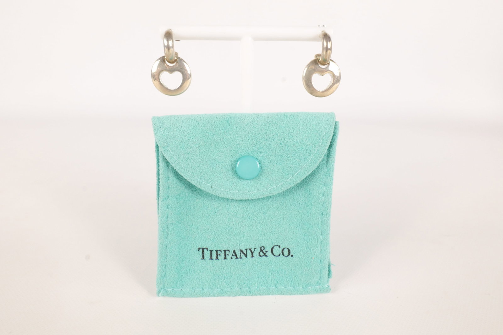 Vintage Tiffany & Co Earrings: Vintage Tiffany and company earrings. Sterling Silver 1999 stencil cut out heart earrings. Open pierced. Comes with original blue bag. Earrings measure approximately 3/4". All invoices must be paid wi