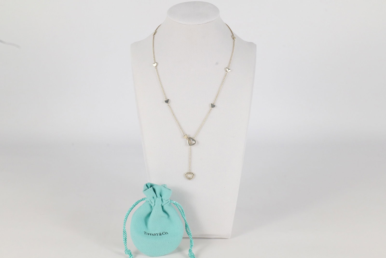 Vintage Tiffany & Co Necklace: Vintage Tiffany and Company Sterling Silver Elsa Peretti open Heart Lariat Necklace. Has the original Tiffany and Company blue bag. The necklace measures approximately 19". All invoices must be paid w