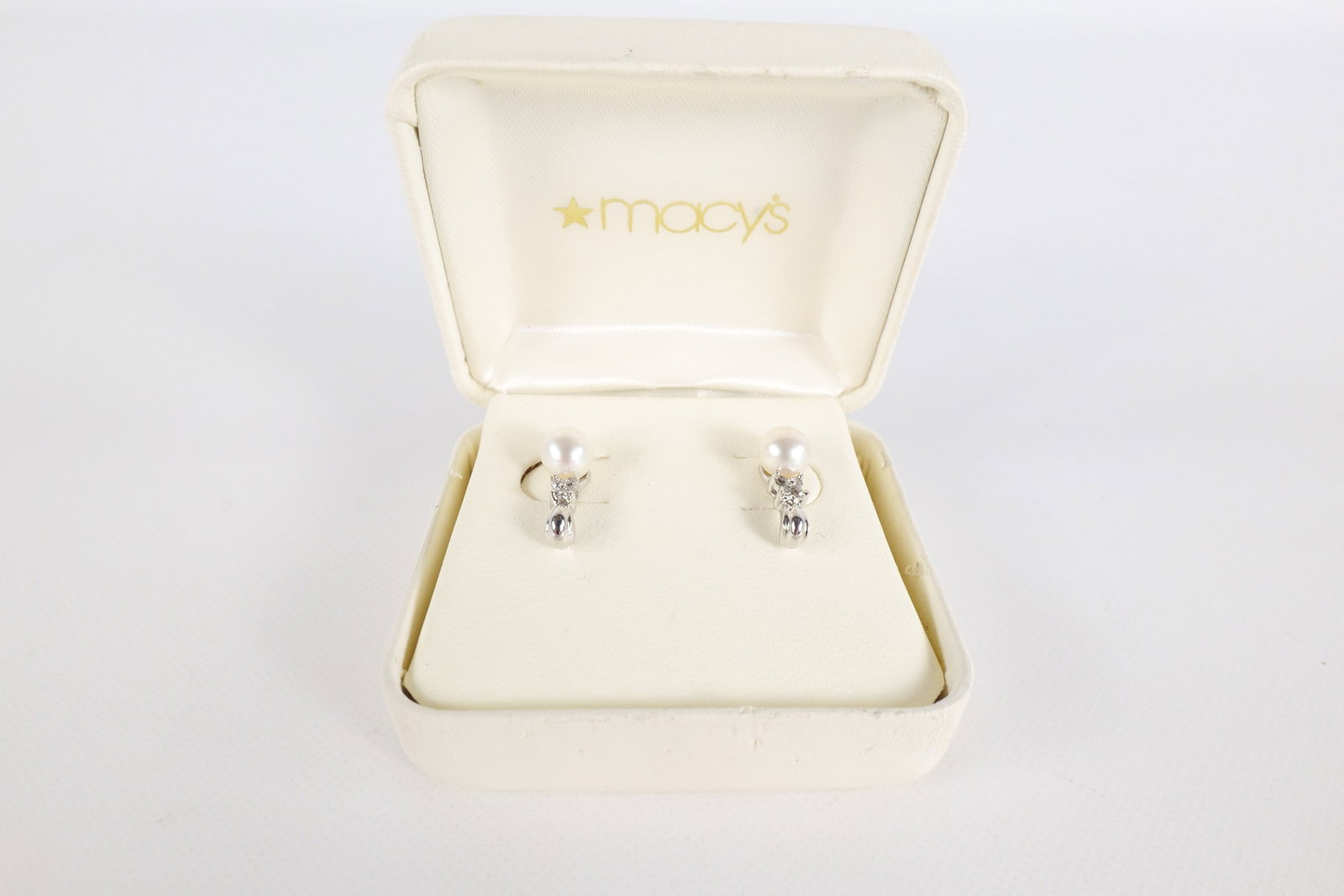 14K Diamond and Pearl Earrings: 14K white gold Pearl and diamond dropped earrings. Earrings are pierced. Pearls measure approximately 6mm and the earrings have approximately one ct worth of diamonds. Earrings measure approximately