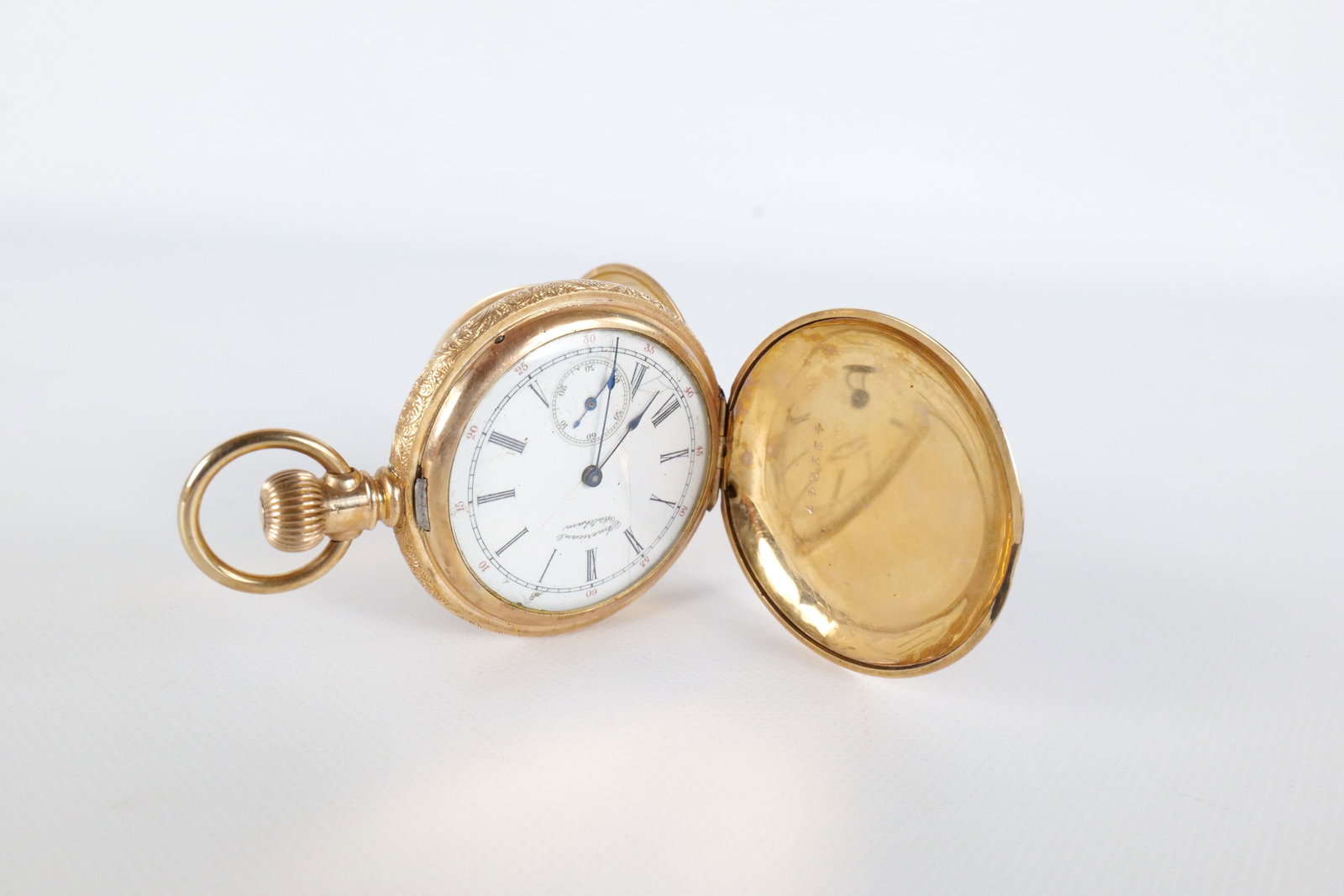 14K American Waltham Pocket Watch: 14 K yellow gold American Waltham Pocket Watch. Has a decorative engraved case with flora and fauna. The case was tested and the outer case tested at 14 K. Is not in running condition. Has some cracks