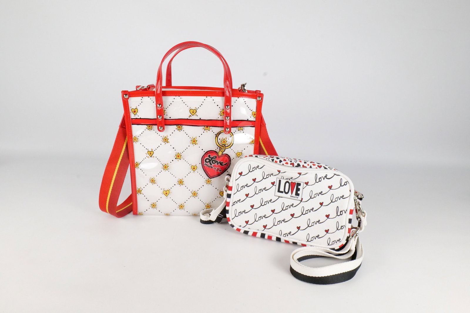 2 Brighton Bags: Lot of 2 Brighton Bags. Including Celebration Plastic Clear Tote Bag and Love Script Crossbody Bag. Both in New without tags condition. Tote measures 13.5? tall x 10? wide. All invoices must be paid