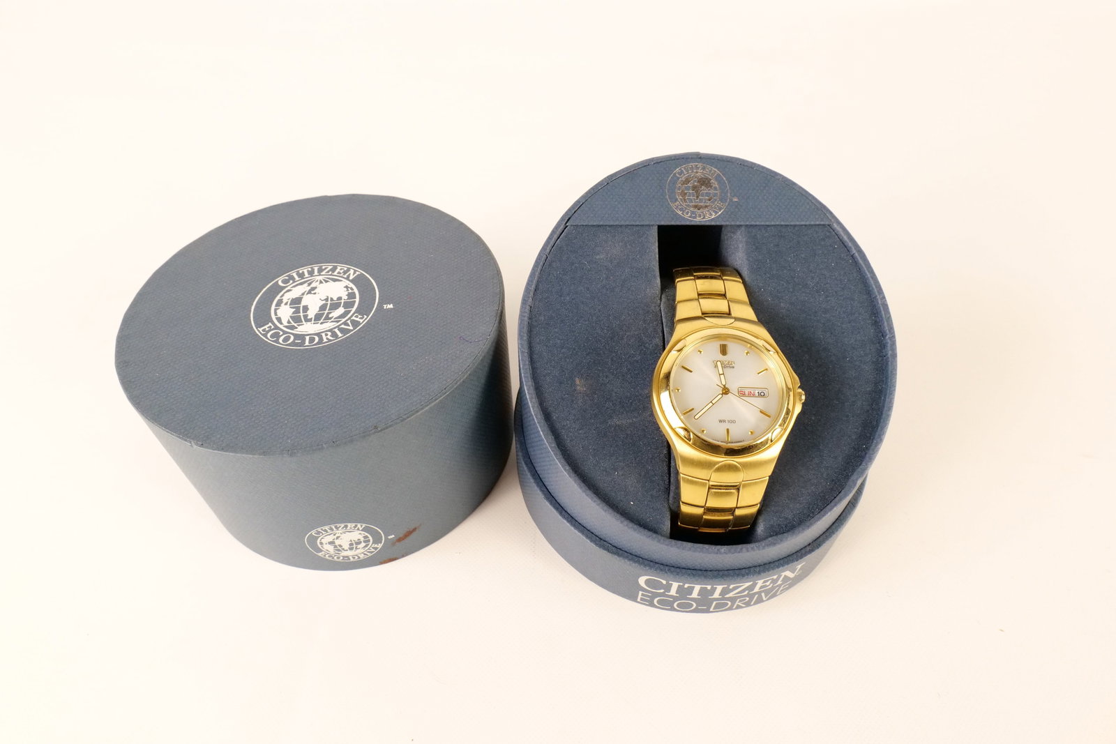 Citizen Eco-Drive Watch: Citizen Men’s Eco-Drive Gold Tone Stainless Steel and Mother of Pearl Solar Powered Watch. Day and Date. Luminous Hands. Light scratches to band. All invoices must be paid within 24 hours of the sal