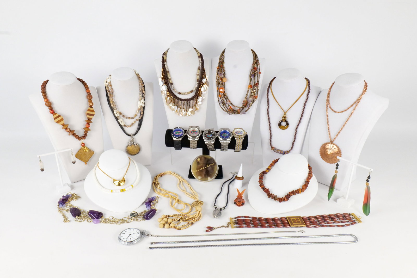 Lot of Costume Jewelry: Large lot of costume jewelry including multiple Florida Gator watches, wooden beaded jewelry, Puca beads, copper jewelry and more. All invoices must be paid within 24 hours of the sale. We offer multi