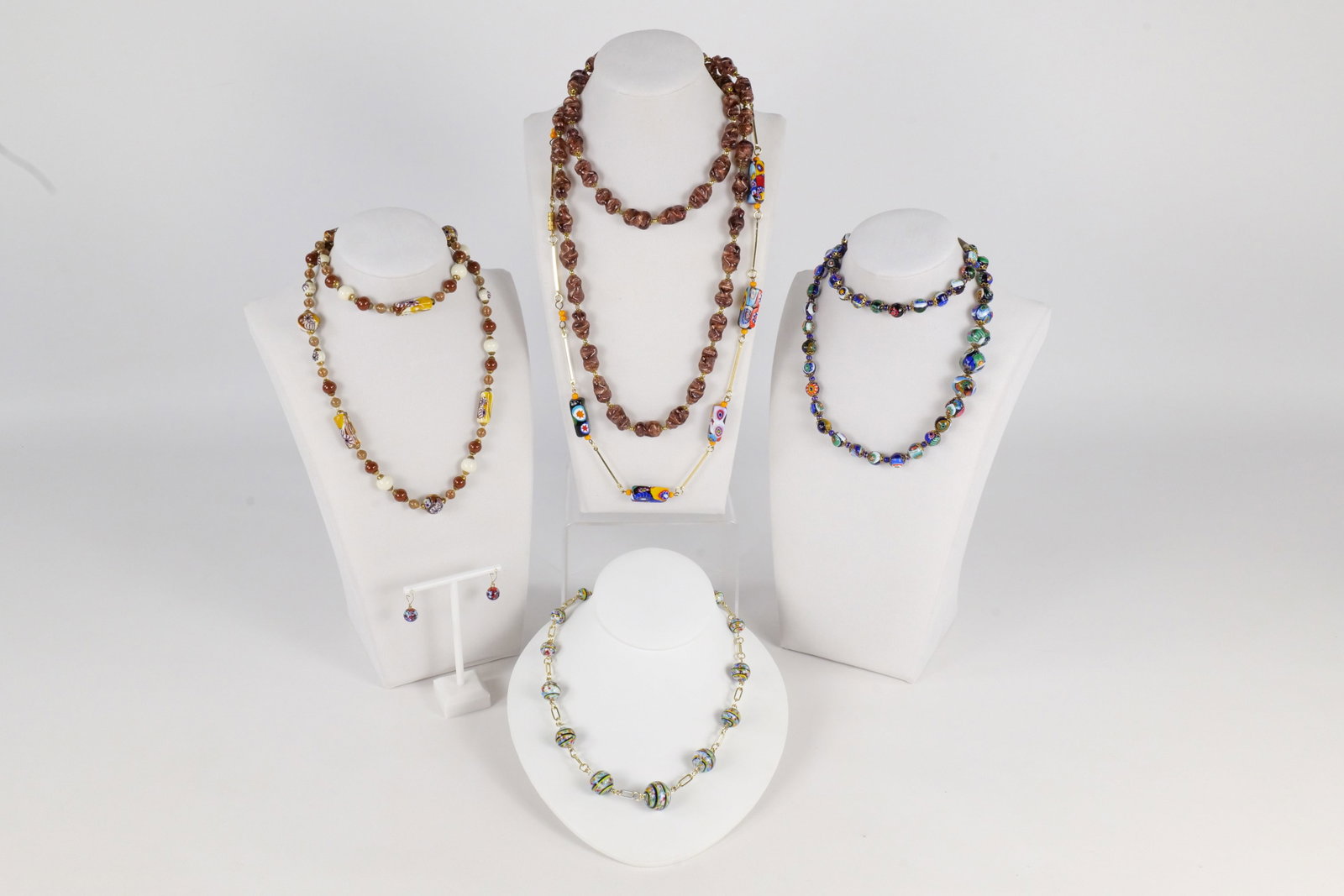 Lot of Glass Murano Millefiori Jewelry: Lot of Glass Murano Millefiori Jewelry. Including 5 Necklaces and Pair of Pierced Earrings. Longest necklace measures 36". All invoices must be paid within 24 hours of the sale. We offer multiple ship
