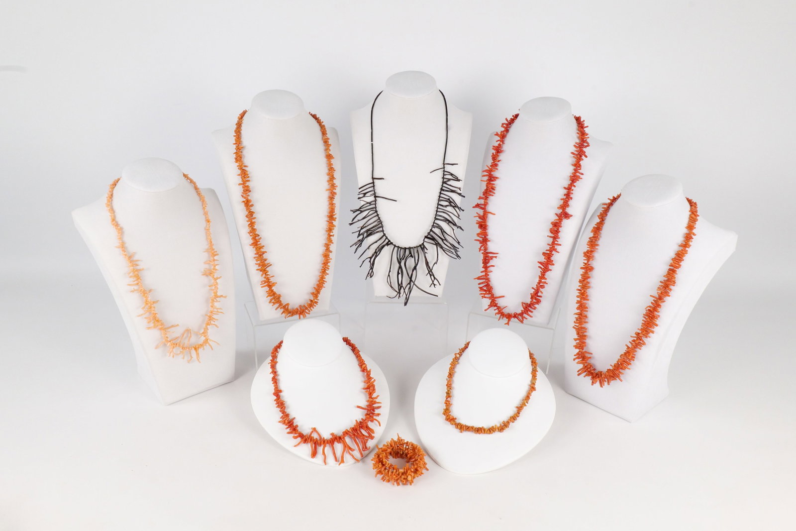 Lot of Branch Coral Jewelry: Lot of Branch Coral Jewelry. Including 7 Necklaces and Wrap Bracelet. Longest measures 28". All invoices must be paid within 24 hours of the sale. We offer multiple shipping options, please read the t