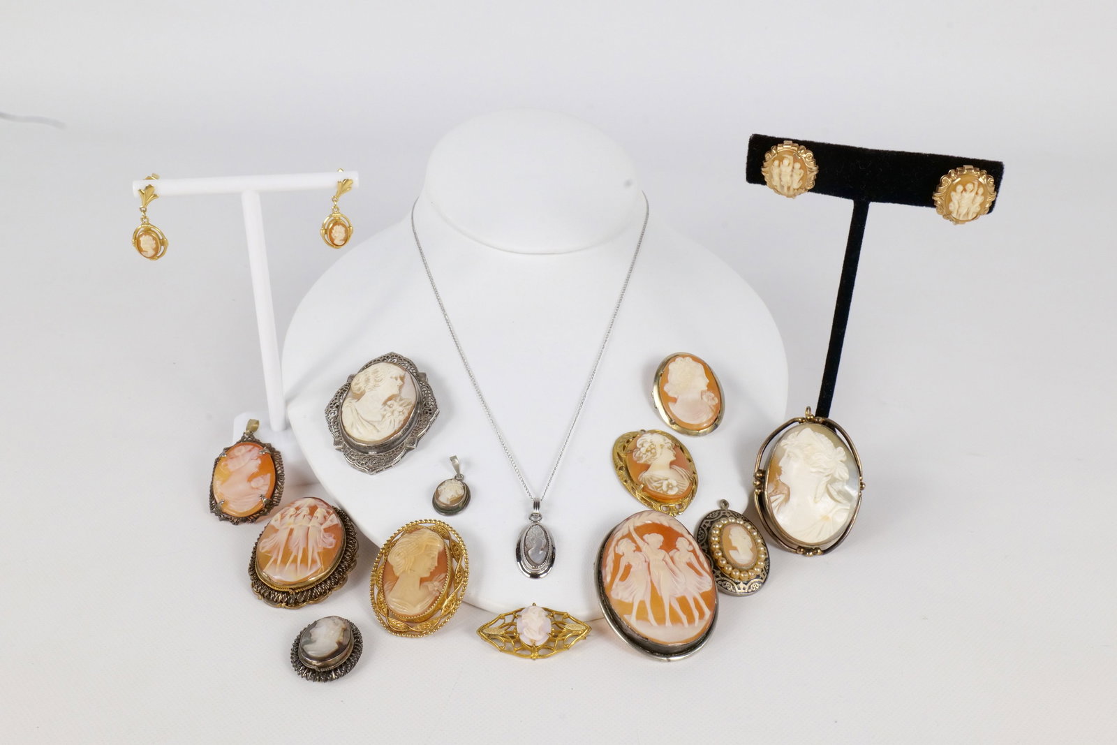 Lot of Cameo Jewelry: Lot of Cameo Jewelry. Including Gold Filled, Silver and Costume. Some marked Coro, Sarah Coventry, Atamore, Krementz. Includes Earrings, Pendants, Brooch. Some bales are missing on pendants. One penda