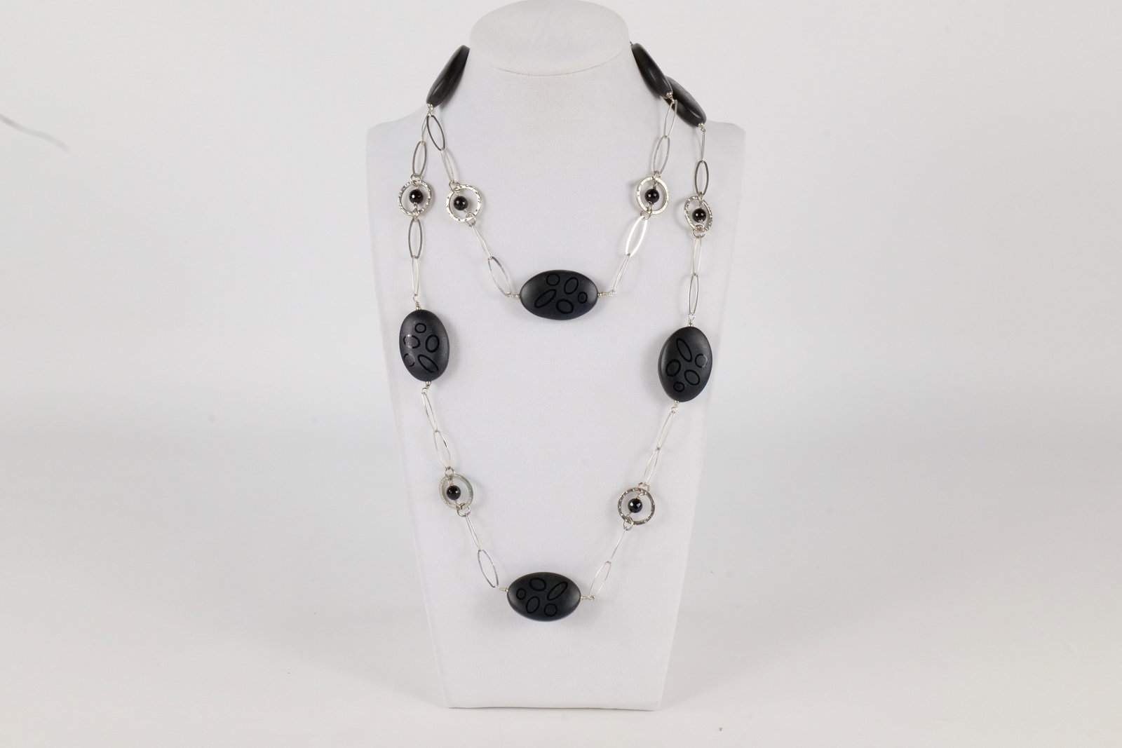 Sterling Silver Etched Black Matte Beads Long Beaded Station Necklace: Sterling Silver Etched Black Matte Beads Long Beaded Station Necklace. Accented with Black Onyx. Measures 38" long. All invoices must be paid within 24 hours of the sale. We offer multiple shipping op