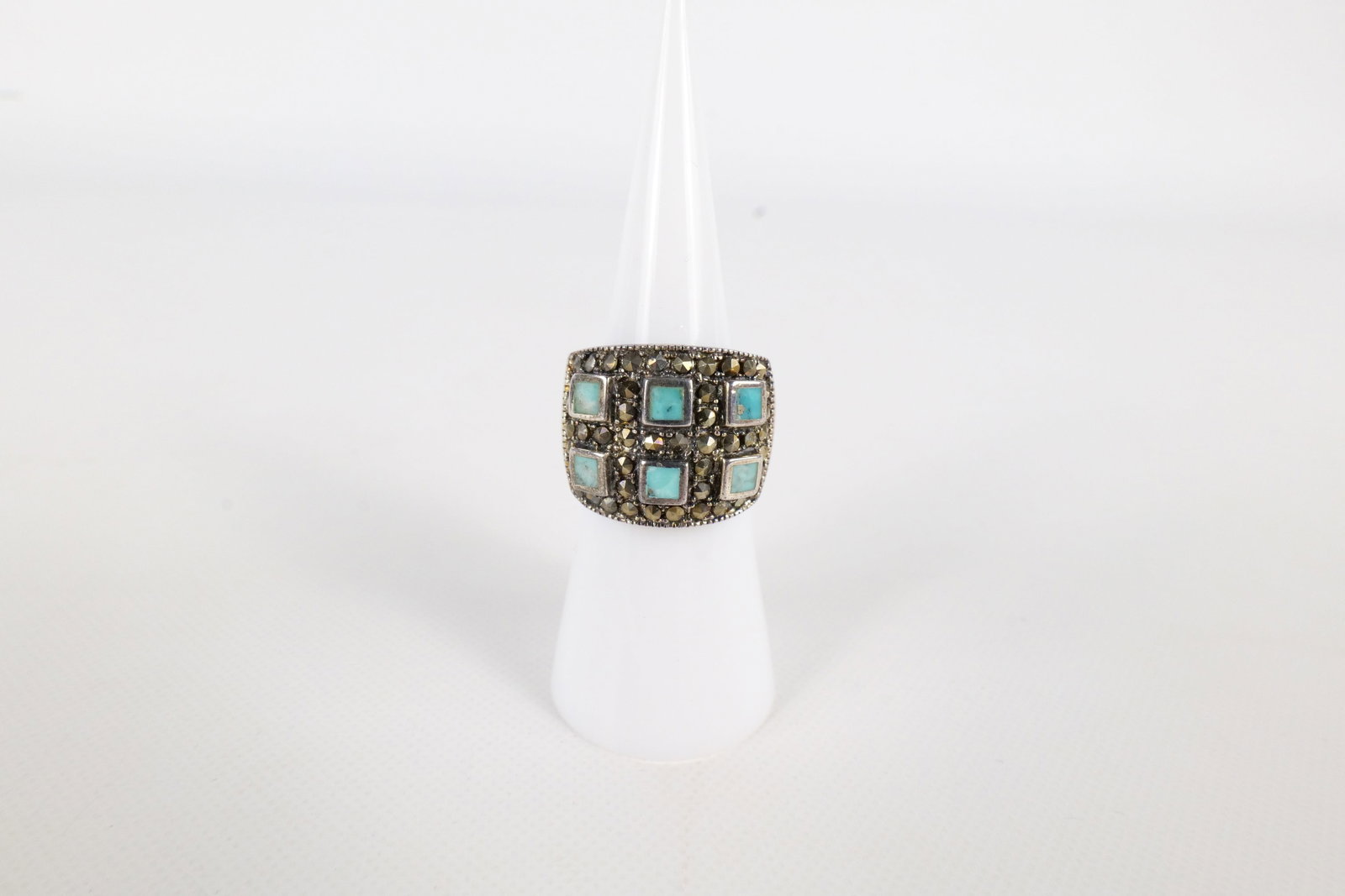 Sterling, Turquoise, and Marcasite Ring: Sterling, Turquoise, and Marcasite Ring. Size 6. Marked. All invoices must be paid within 24 hours of the sale. We offer multiple shipping options, please read the terms to understand your options. We