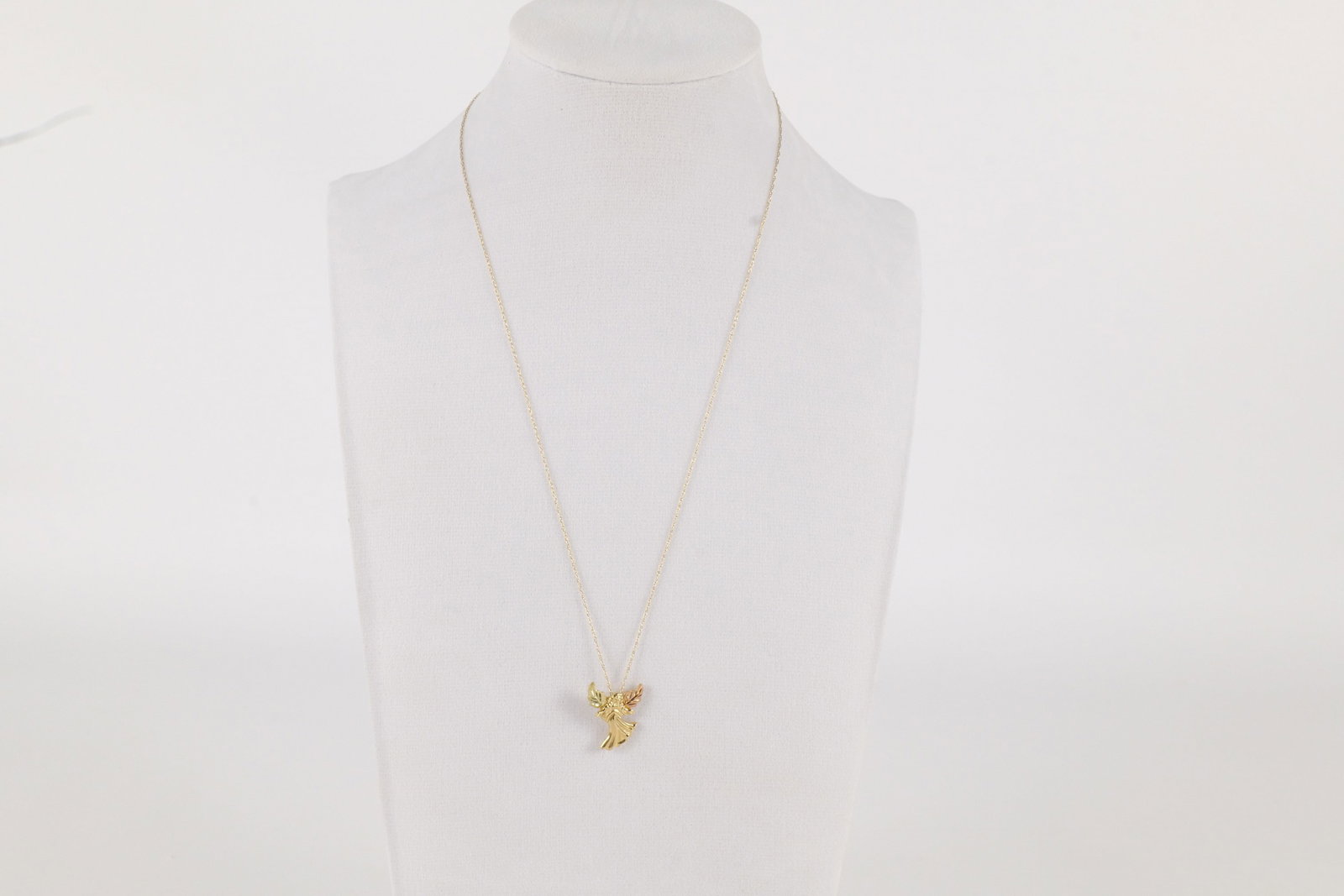 10k Yellow Gold Dainty Chain with Angel: 10k Yellow Gold Dainty Chain with Yellow/Rose and Green Gold Angel Charm. Both Marked. Chain measures 17". Weighs 1.8 grams. All invoices must be paid within 24 hours of the sale. We offer multiple