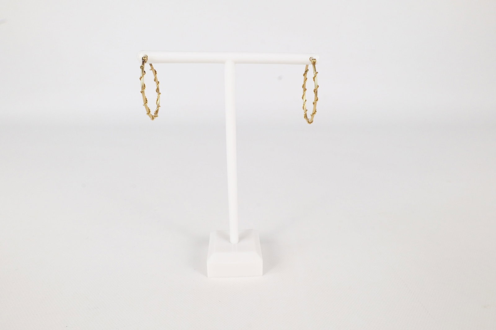 Pair of 14k Wire Wrapped Hooped Pierced Earrings: Pair of 14k Wire Wrapped Hooped Pierced Earrings. Measures 1 1/16" long. Weigh 1.8 grams. All invoices must be paid within 24 hours of the sale. We offer multiple shipping options, please read the