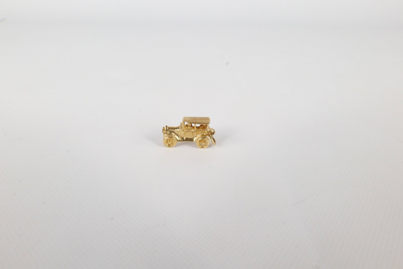 14k Car Charm: 14k Car Charm. Measures 3/4" long. Weighs 3.5 grams. All invoices must be paid within 24 hours of the sale. We offer multiple shipping options, please read the terms to understand your options. We