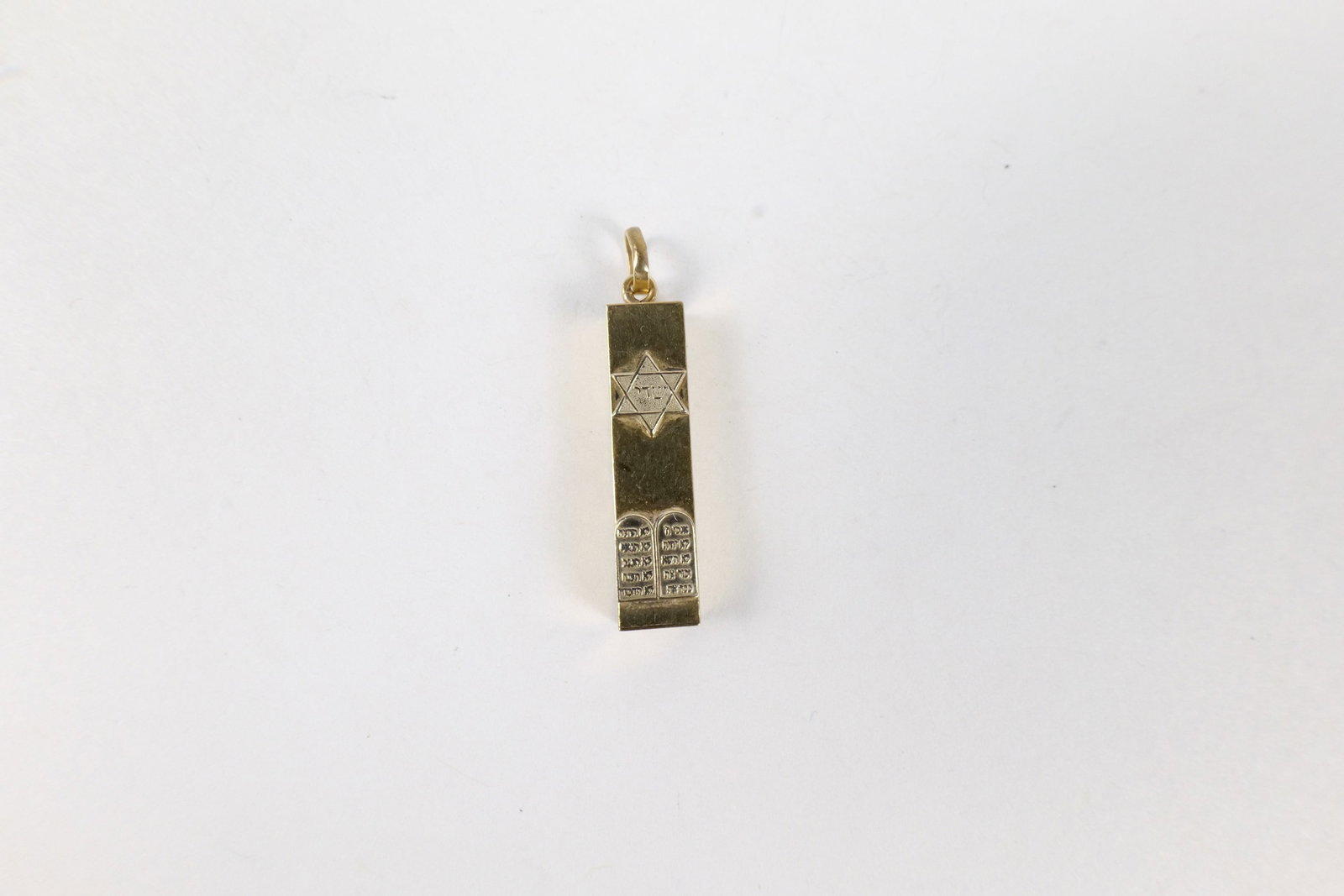14k Yellow Gold Mezuzah Pendant: 14k Yellow Gold Mezuzah Pendant. Marked. Measures 1.25". Weighs 1.5 grams. All invoices must be paid within 24 hours of the sale. We offer multiple shipping options, please read the terms to understan