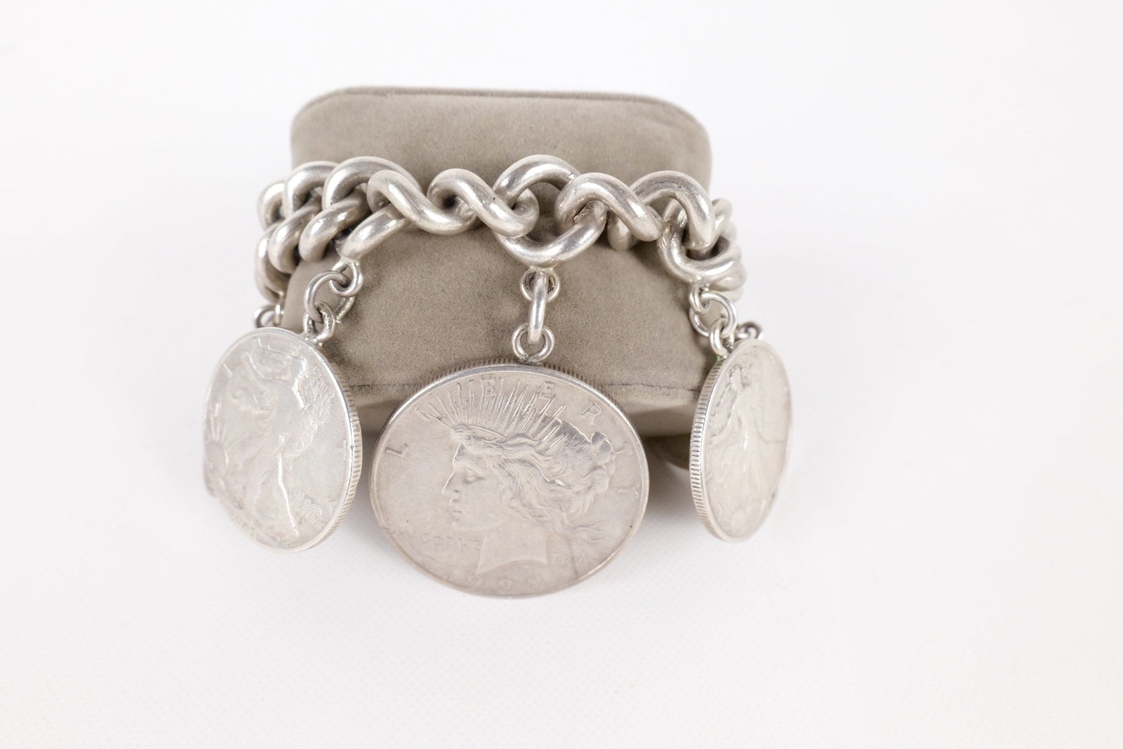 Silver Charm Bracelet: Silver Charm Bracelet - Made in Mexico. Comes with 6 US Silver Coins. Measures 7.5". All invoices must be paid within 24 hours of the sale. We offer multiple shipping options, please read the terms to