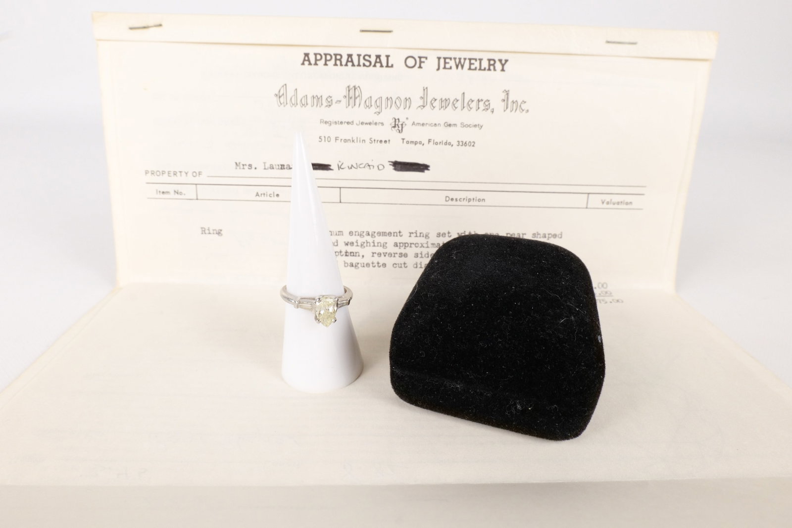 Platinum and Diamond Engagement Ring: Platinum Engagement Ring - Size 7. Contains 1 pear shaped diamond weighing 1.09 carats and 2 12 Point tapered baguette cut diamonds. Comes with appraisel from 1972. All invoices must be paid within 24
