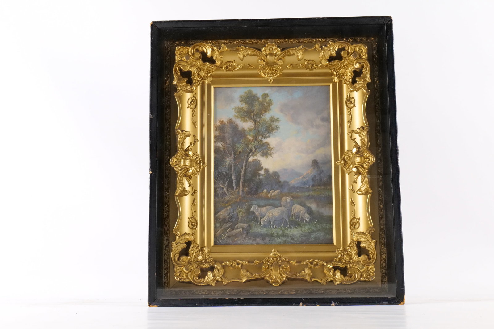 19th Century Oil on Canvas - Landscape with Sheep: 19th Century Oil on Canvas. Depicting a landscape with sheep near a stream. Nice blue and lavender skies. Comes in shadowbox frame. Measures 20" tall x 17" wide. All invoices must be paid within 24 ho