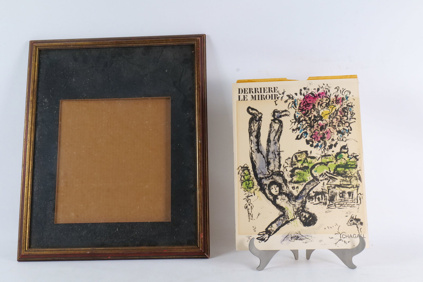 Marc Chagall Colored Lithograph - The Acrobat: Marc Chagall Colored Lithograph. Entitled "The Acrobat". Comes with frame. Frame measures 22" tall x 18" wide. All invoices must be paid within 24 hours of the sale. We offer multiple shipping options