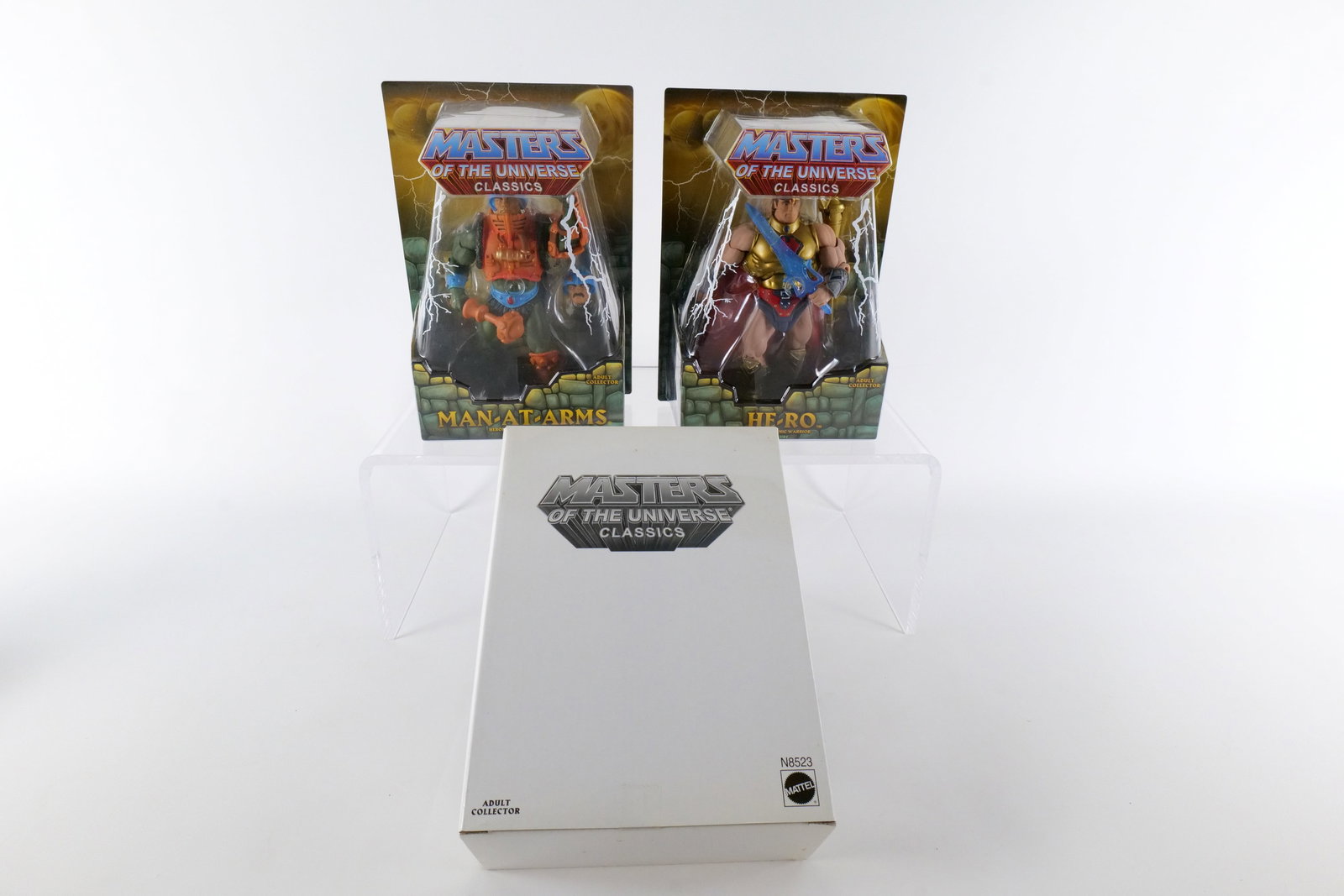 Lot of 2 Masters of the Universe Classics Action Figures: Lot of 2 Masters of the Universe Classics Action Figures. MOTU. Including Man-At-Arms and He-Ro. Both New in Package - Man-At-Arms does not have the white outer box but He-Ro does. Made by Mattel - 20